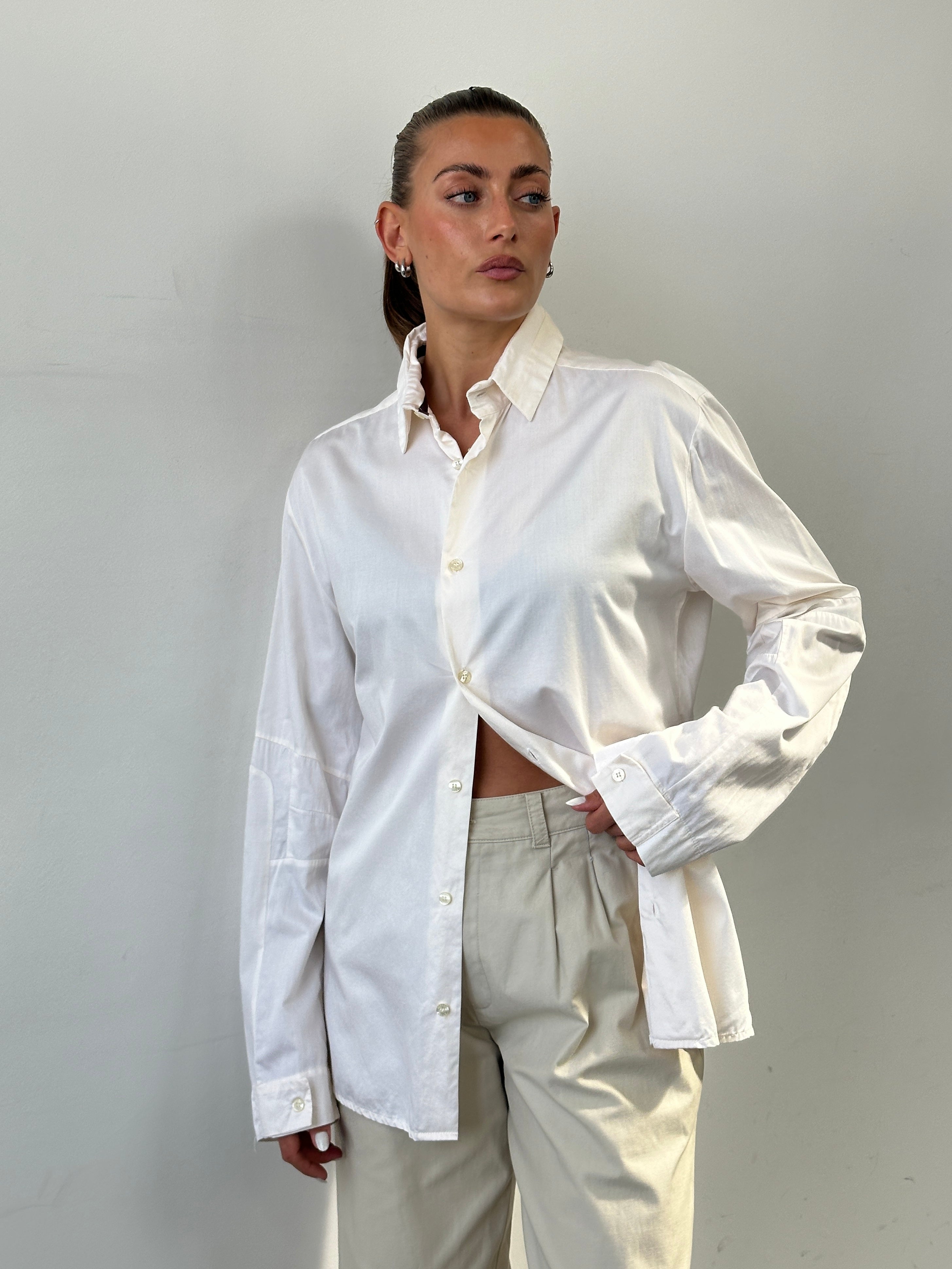 Versace Sport 90s pure cotton shirt in size L, featuring classic design and Versace branding, displayed on a hanger.