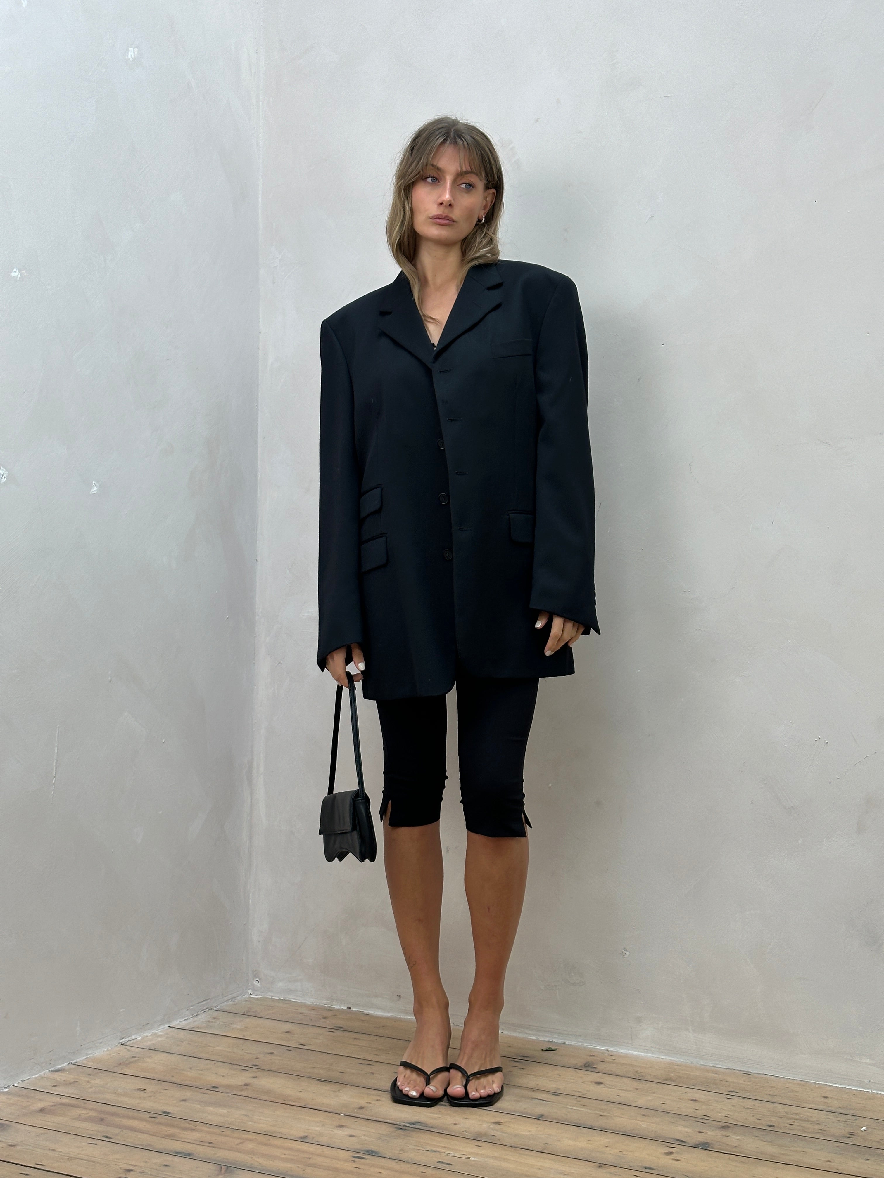 Yves Saint Laurent pure wool single-breasted blazer in size 44L/XL-XXL, tailored fit with classic lapels and button closure.