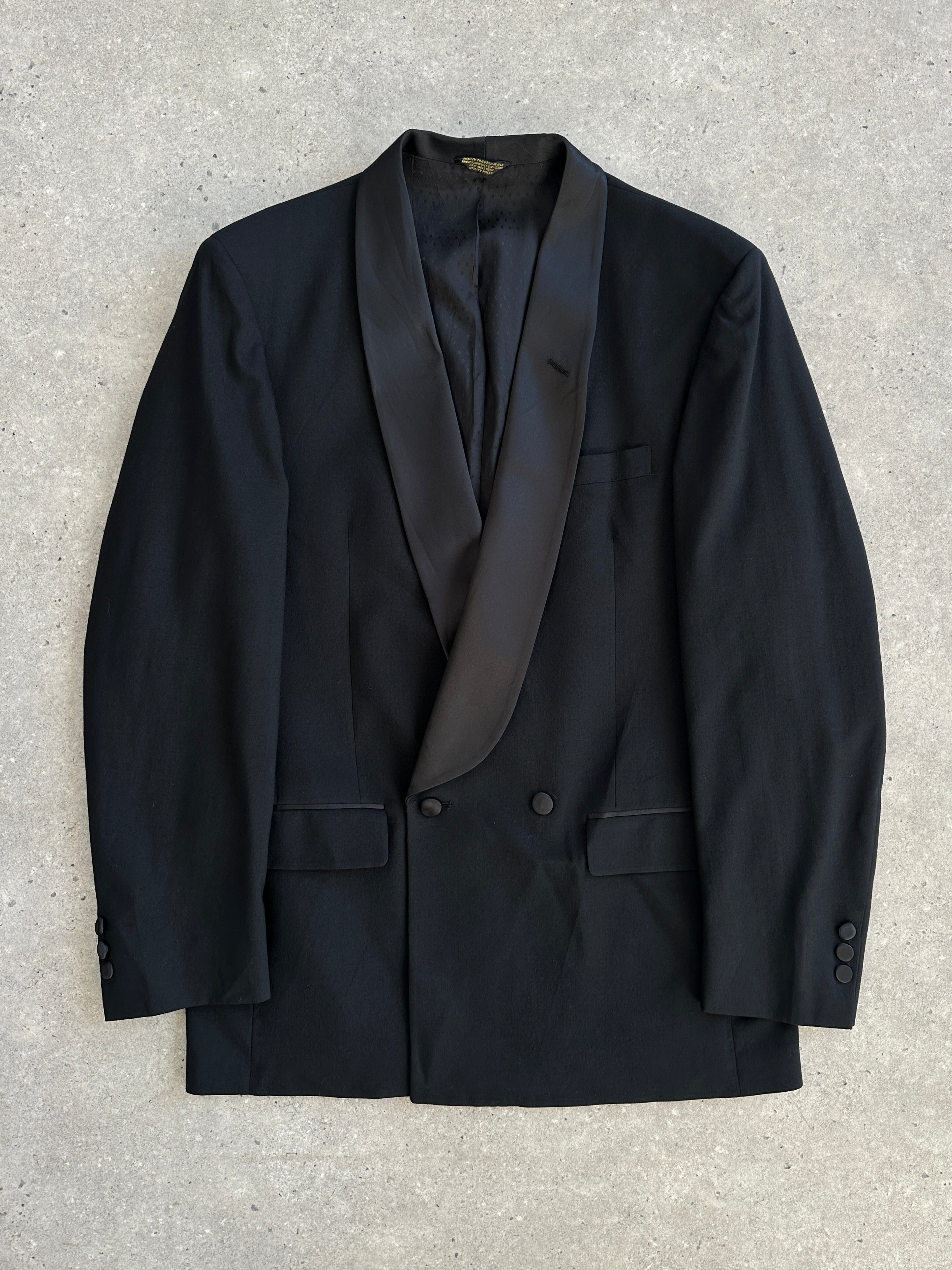 Christian Dior Monsieur 1980s pure wool tuxedo blazer in size 40R/XL, classic black tailored blazer with notch lapel and button details.