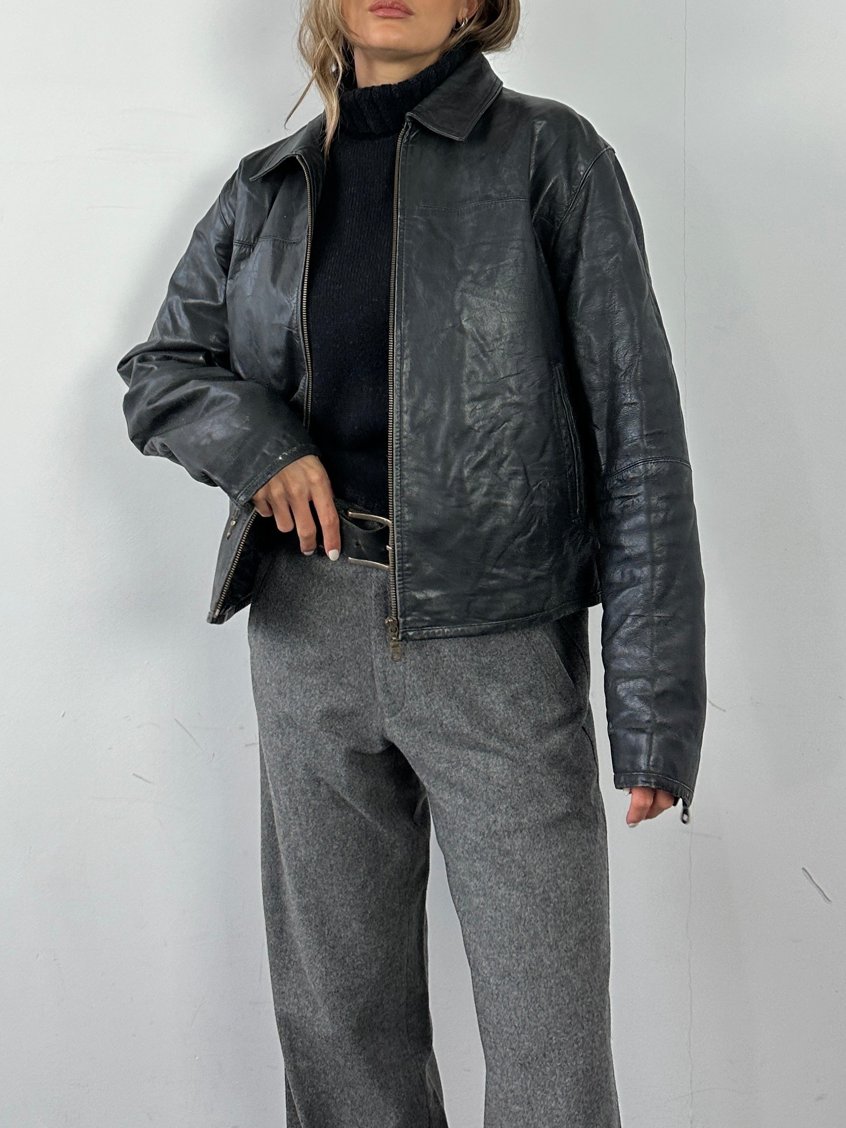 Conbipel leather jacket in size M/L, stylish black men's outerwear with smooth leather finish and classic collar detail.