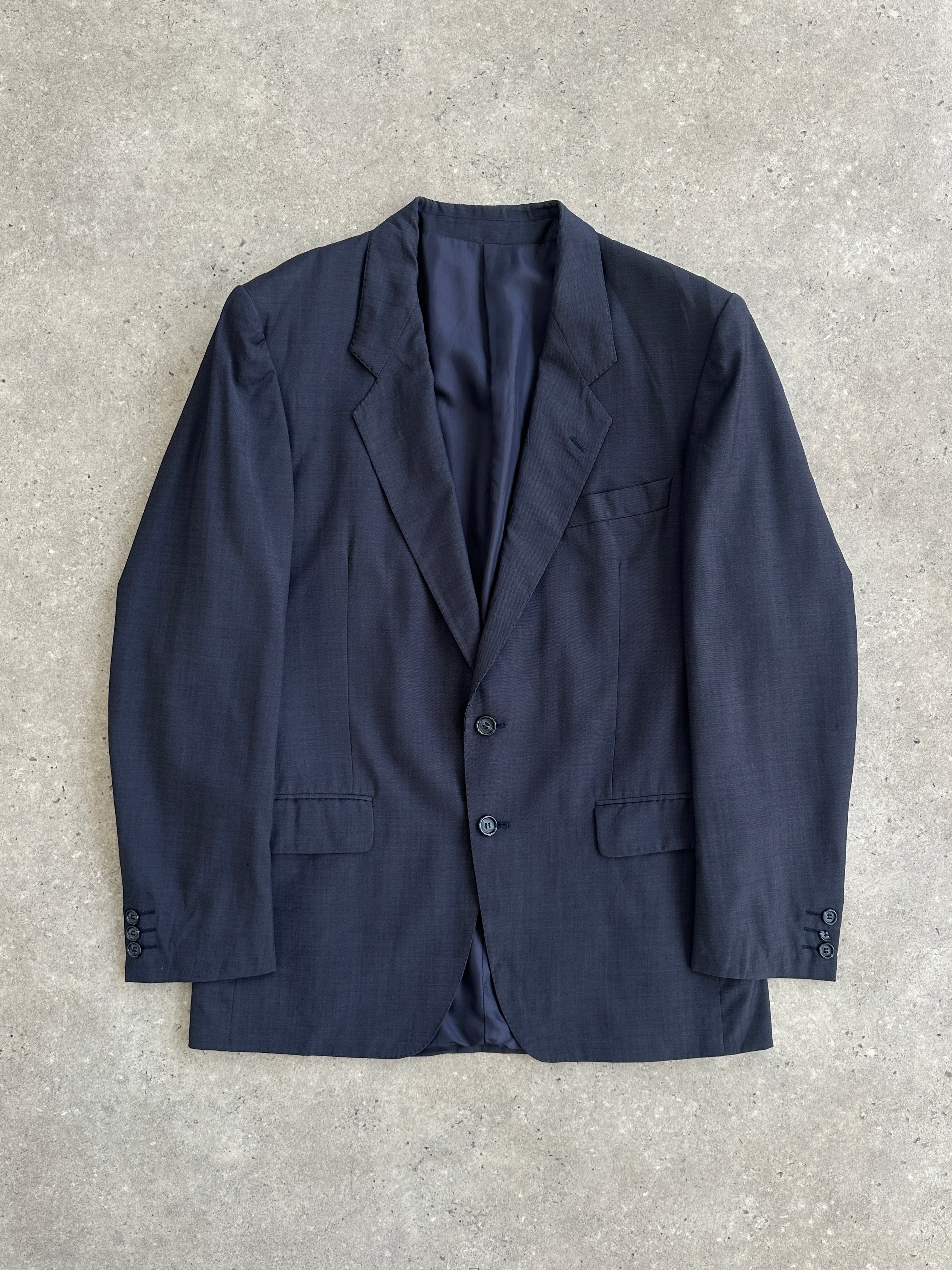 Yves Saint Laurent Pour Homme 1980s pure wool blazer in size 40R/M, tailored fit with classic lapel and button closure.