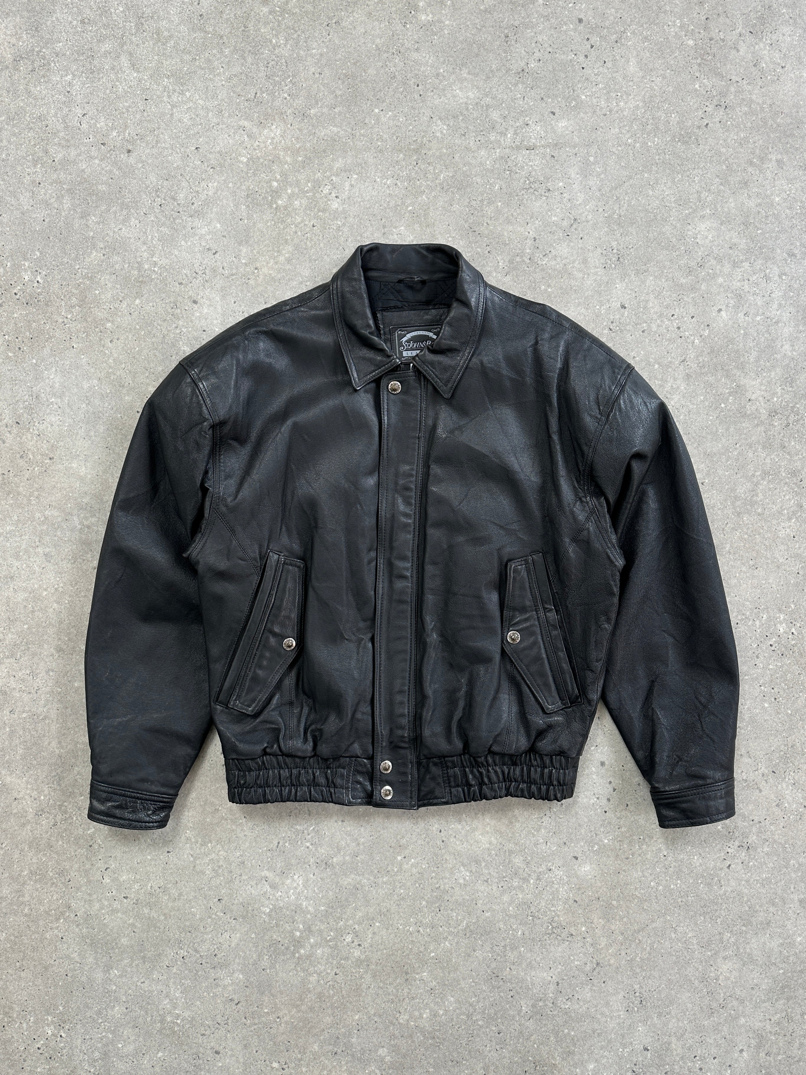 Vintage 1990s leather bomber jacket with a classic blouson style, featuring a zip front and ribbed cuffs in a size large.