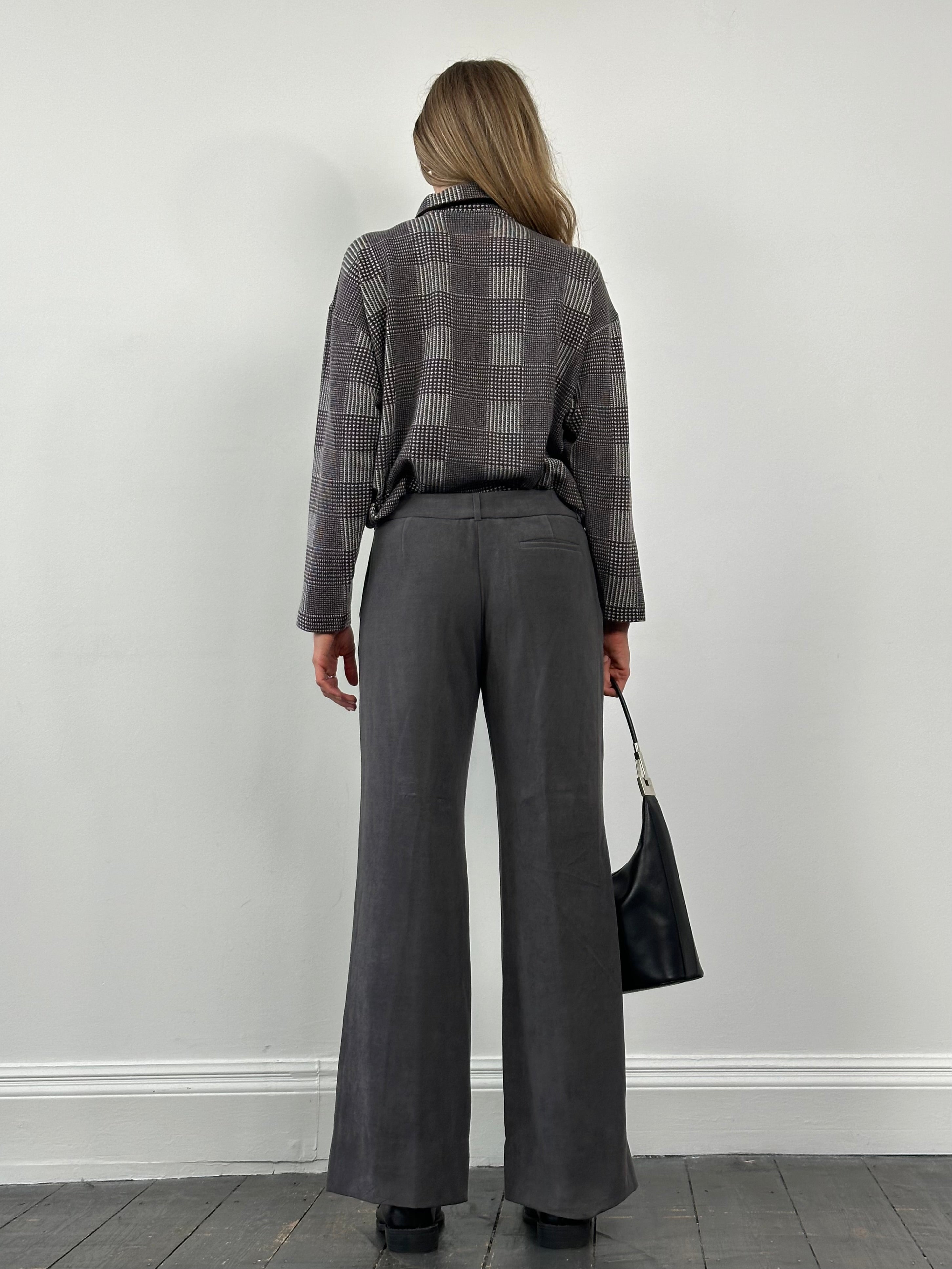 Emporio Armani wide leg low rise trousers in dark fabric, featuring a relaxed fit and stylish design, size W30.