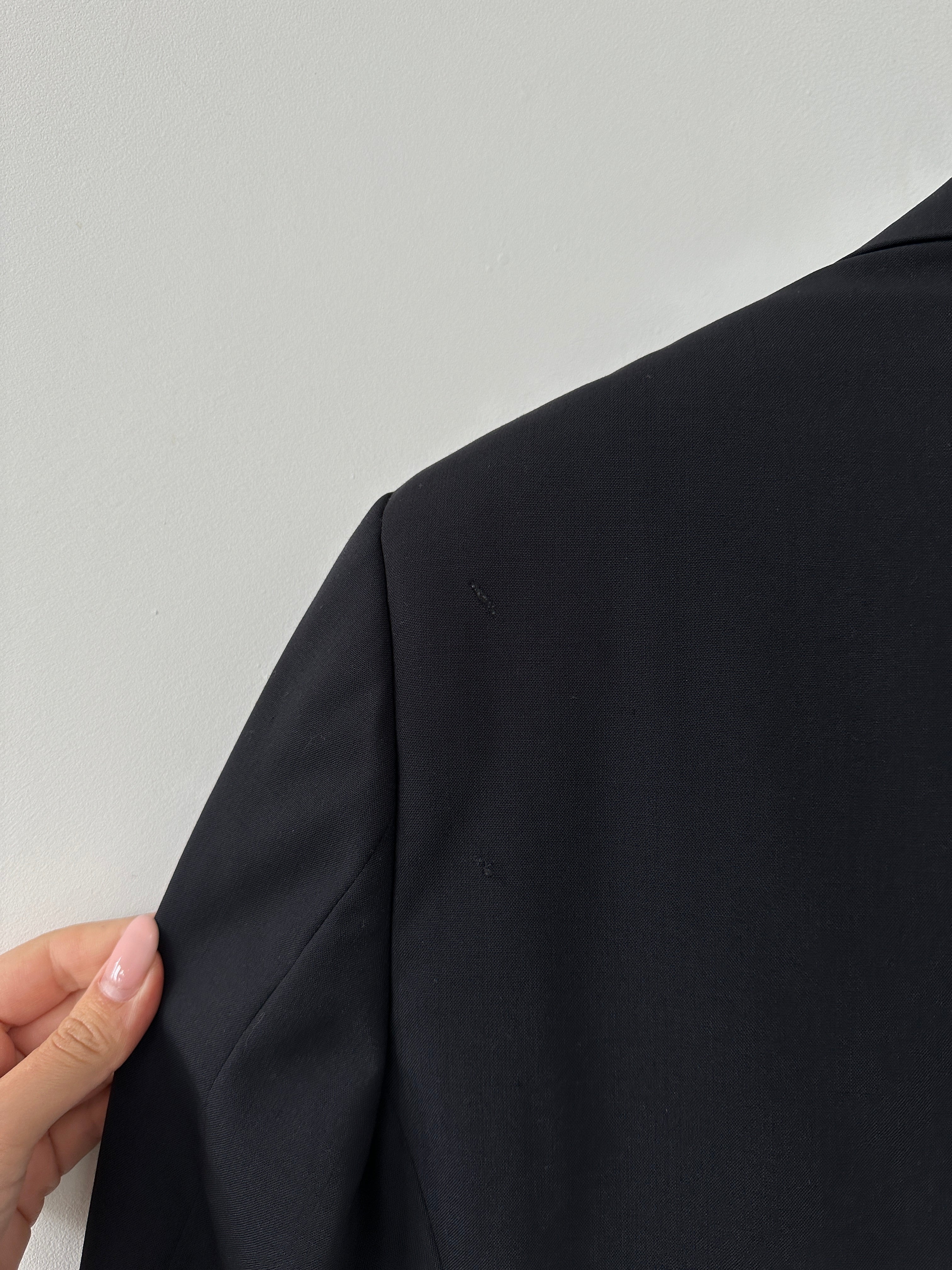 Emporio Armani wool single-breasted blazer in size 38R/M, tailored fit with notch lapel and classic design, shown on a hanger.