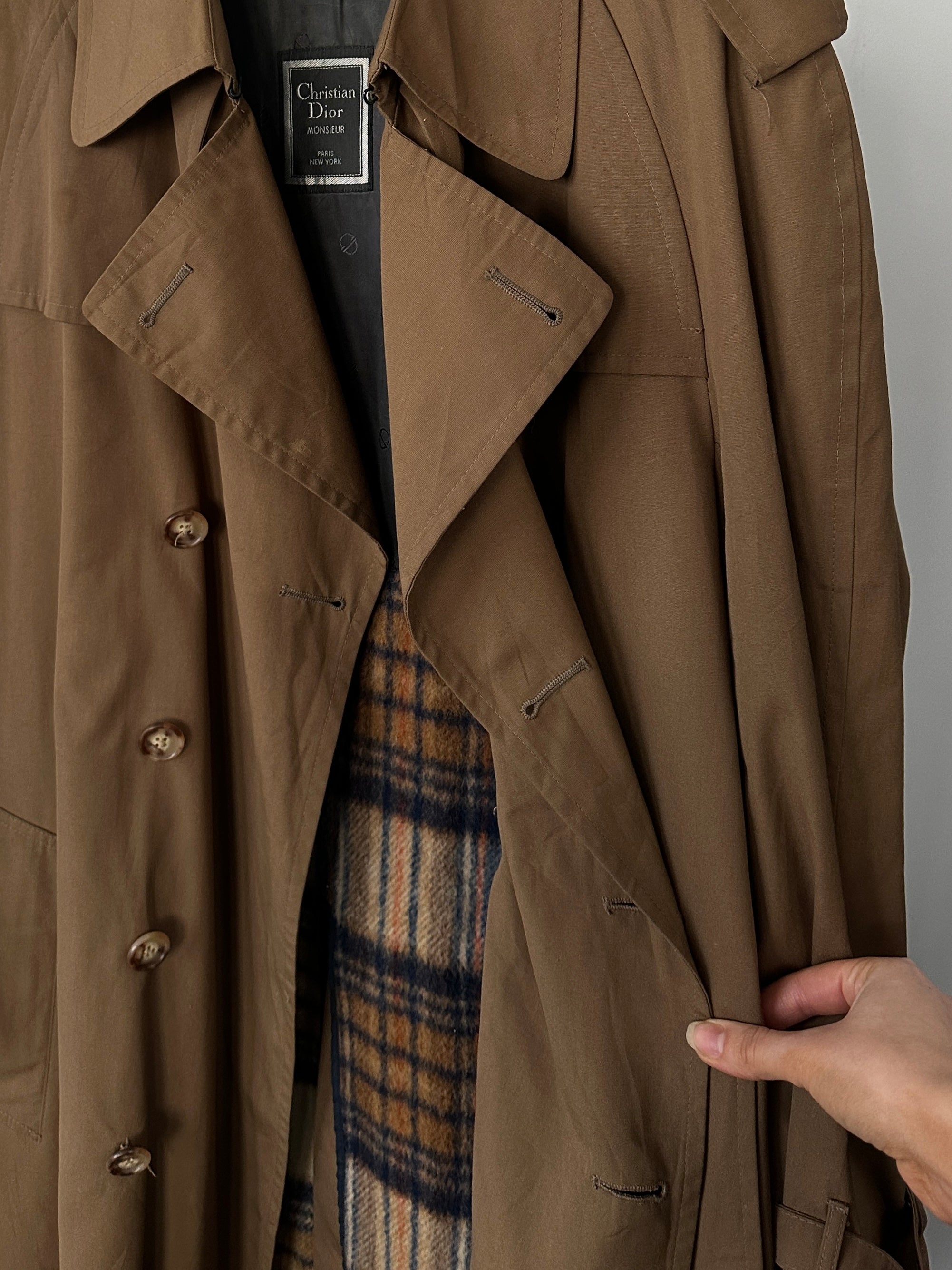 Christian Dior cotton double-breasted trench coat in size L with classic design and belt, displayed on a mannequin.