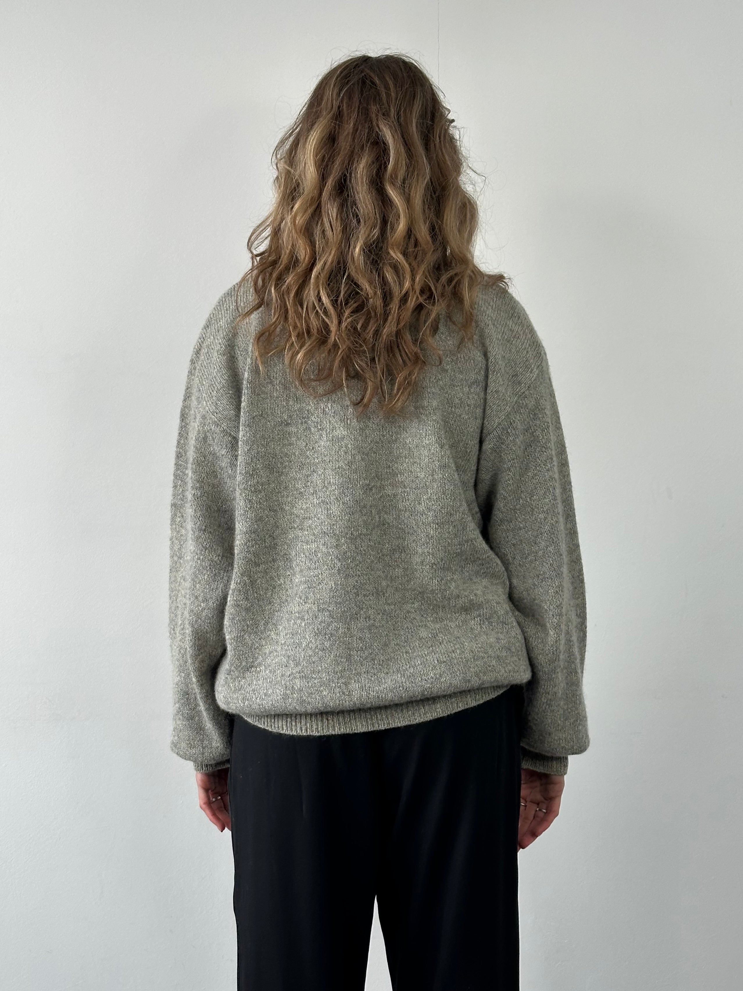 Emanuel Ungaro XL pure wool knitted cardigan with button closure, featuring a soft, textured knit pattern and classic fit.