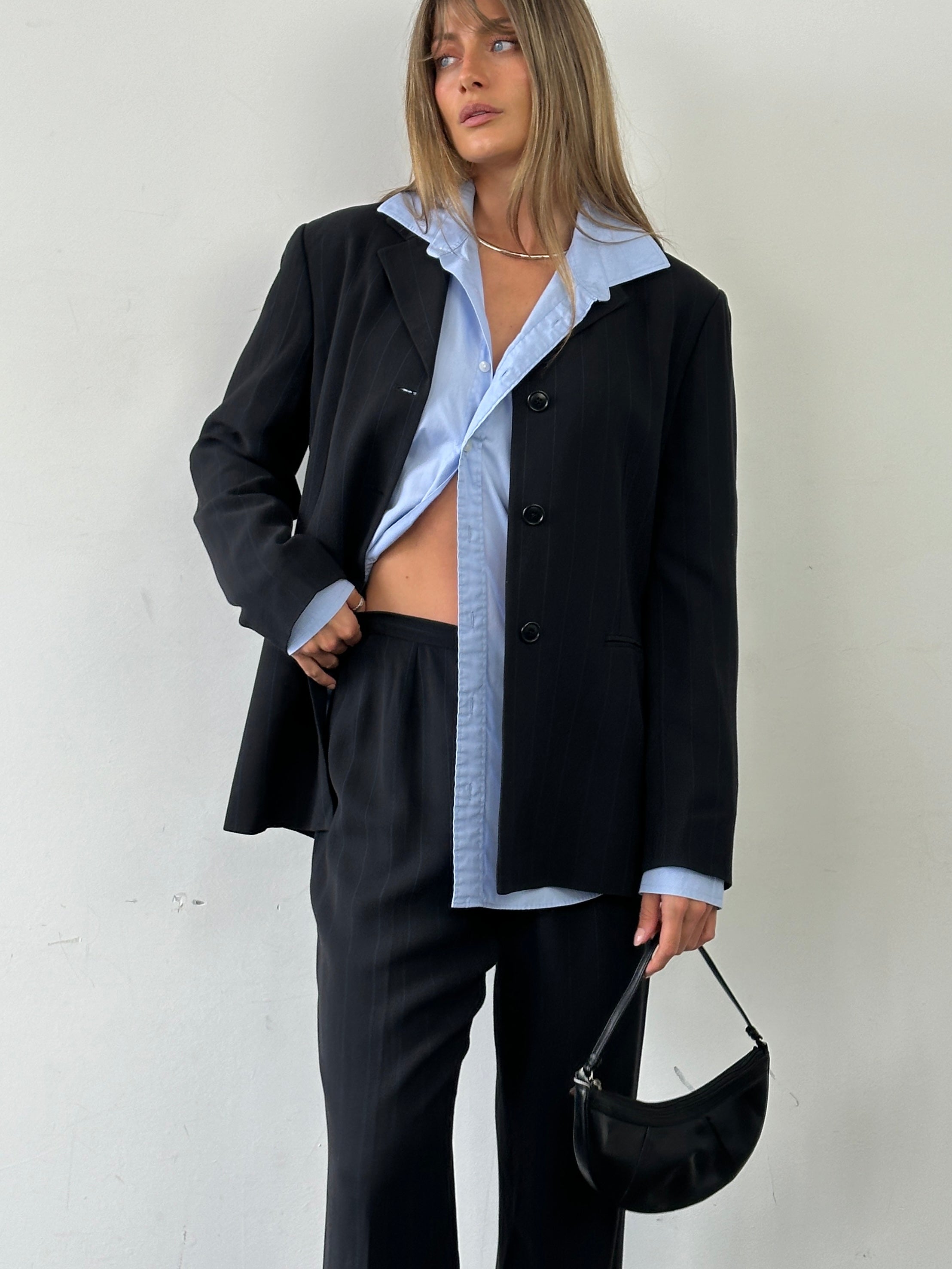 Marella Virgin Wool Blend Jumpsuit with single-breasted design, featuring a sleek fit and tailored style.