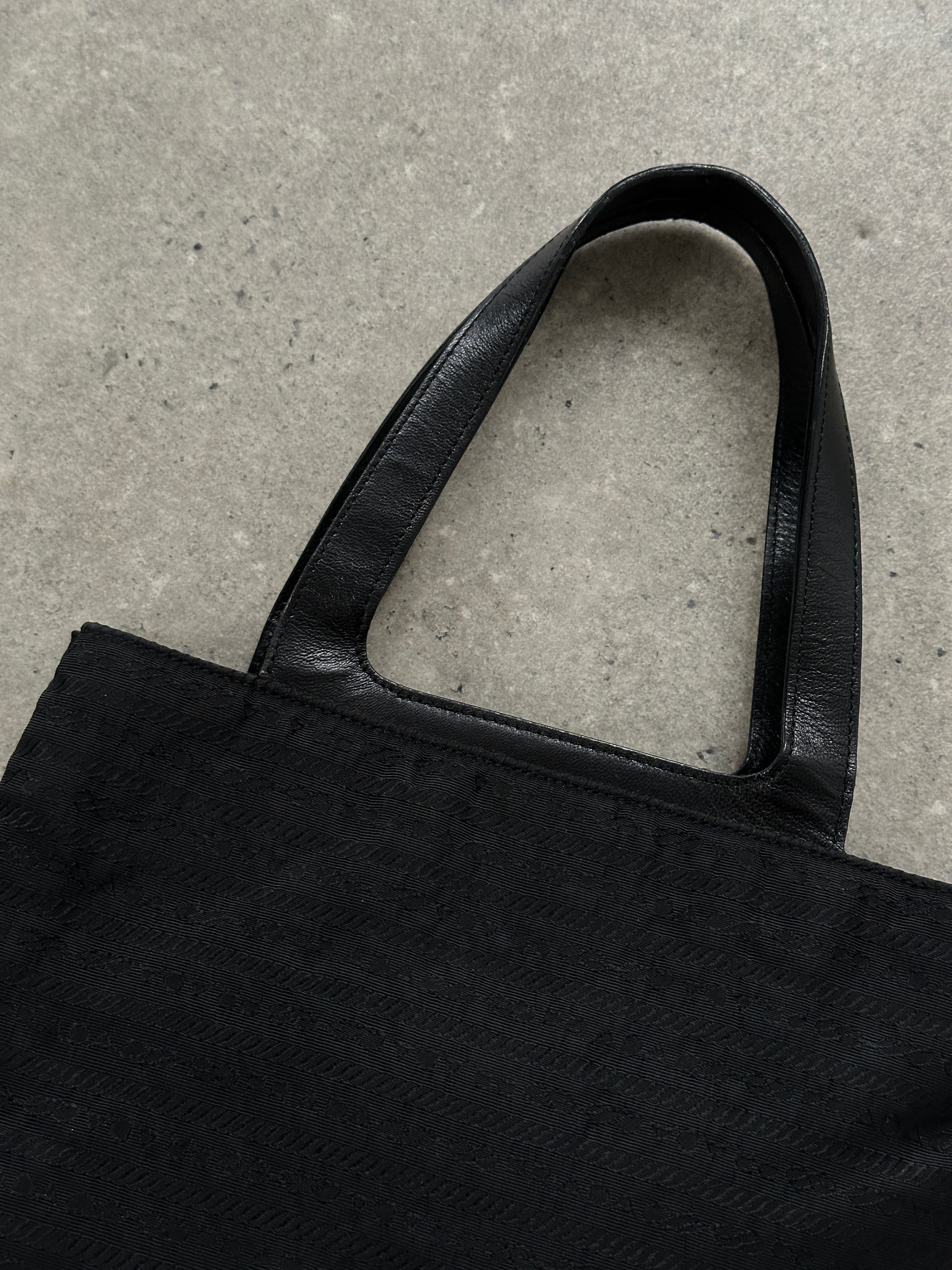 Prada 1990s Tessuto Monogram handbag with leather accents, showcasing the classic monogram design and structured shape.