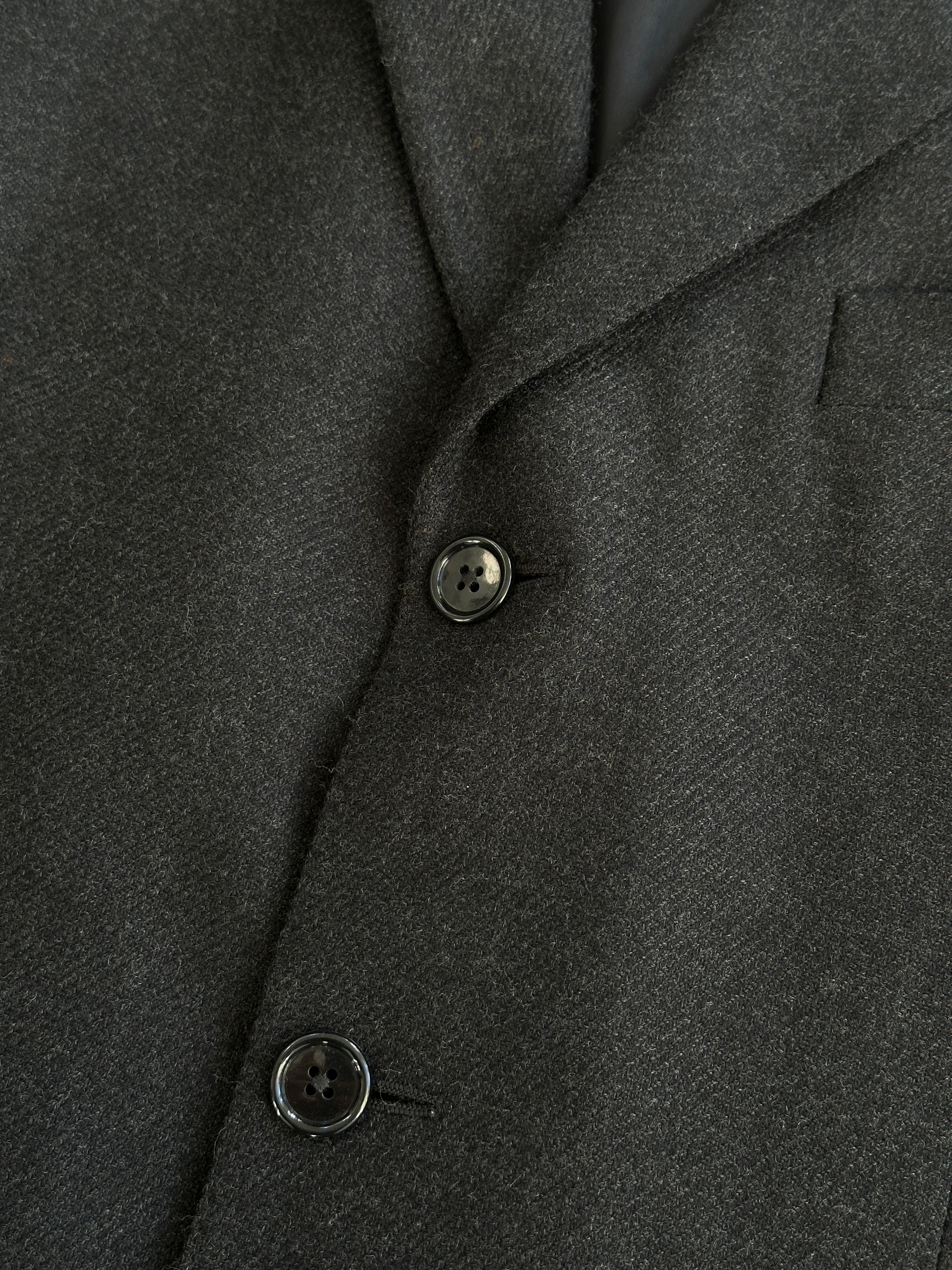 Loro Piana wool cashmere single-breasted blazer in size 40R/L, tailored fit, in neutral color, displayed on a hanger.