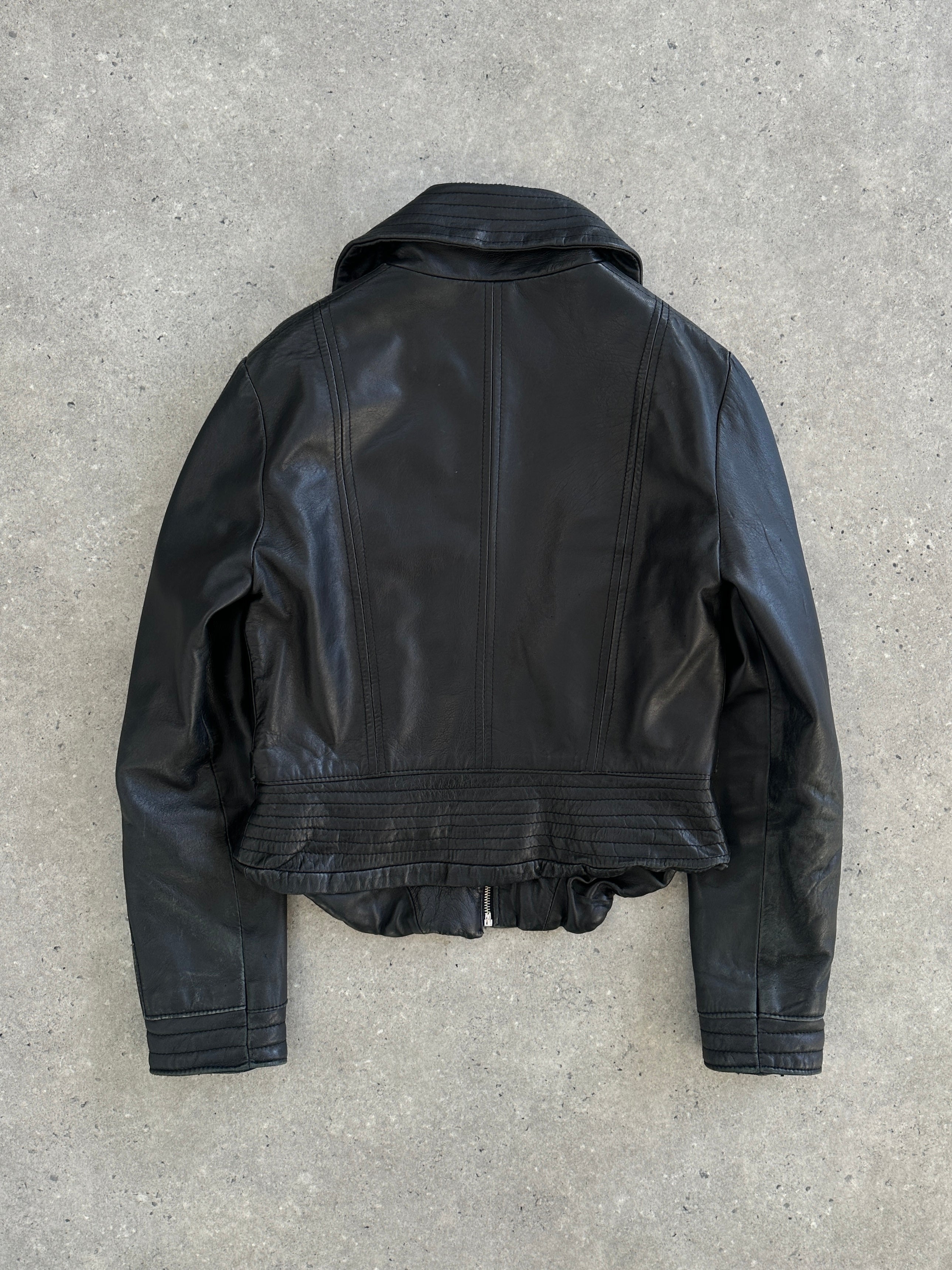 Vintage Italian 1990s fitted leather jacket with buckled design, size small, showcasing classic vintage craftsmanship.