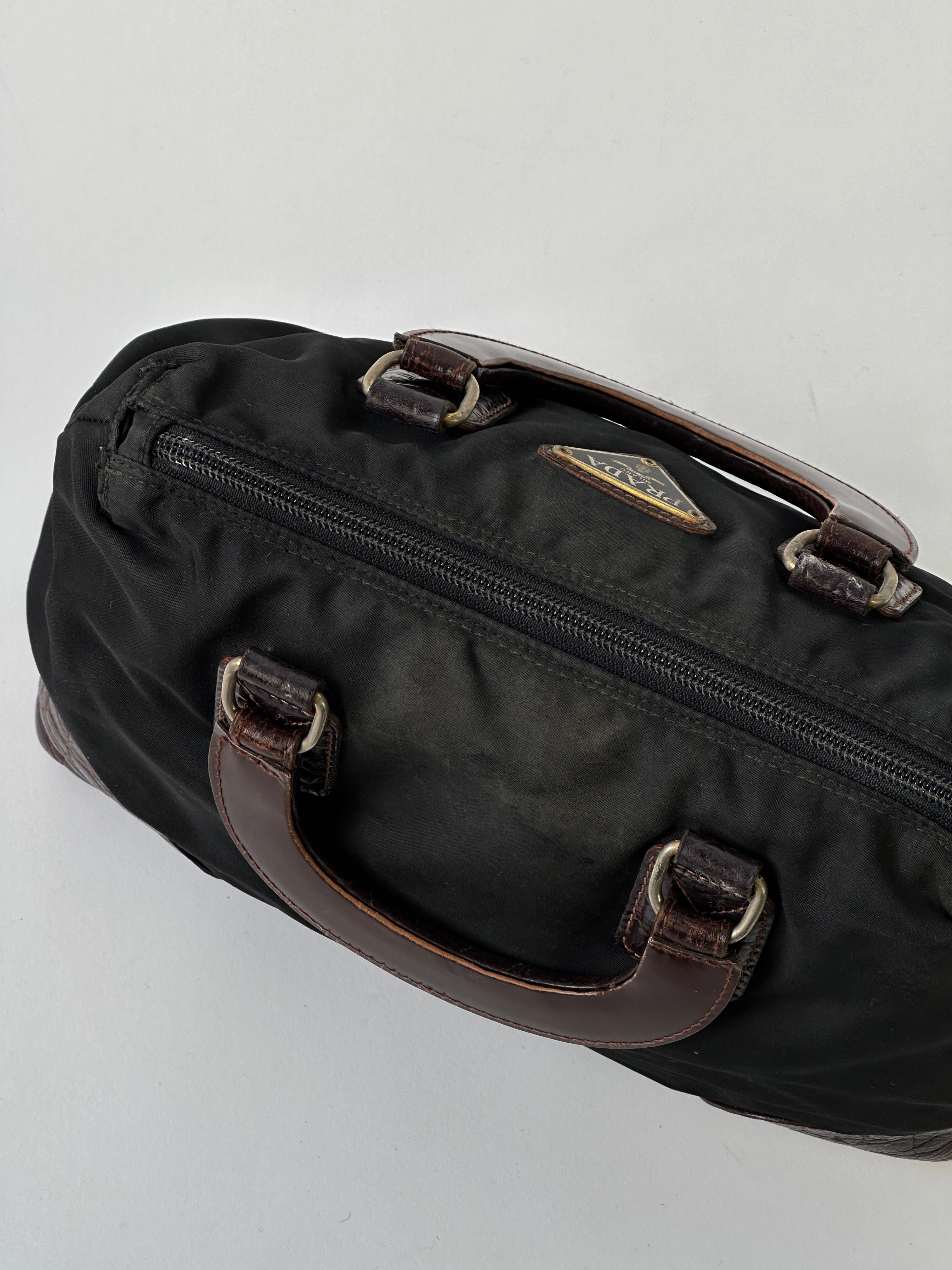 Prada nylon croc handbag featuring sleek design, textured crocodile pattern, and sturdy handle for stylish everyday use.