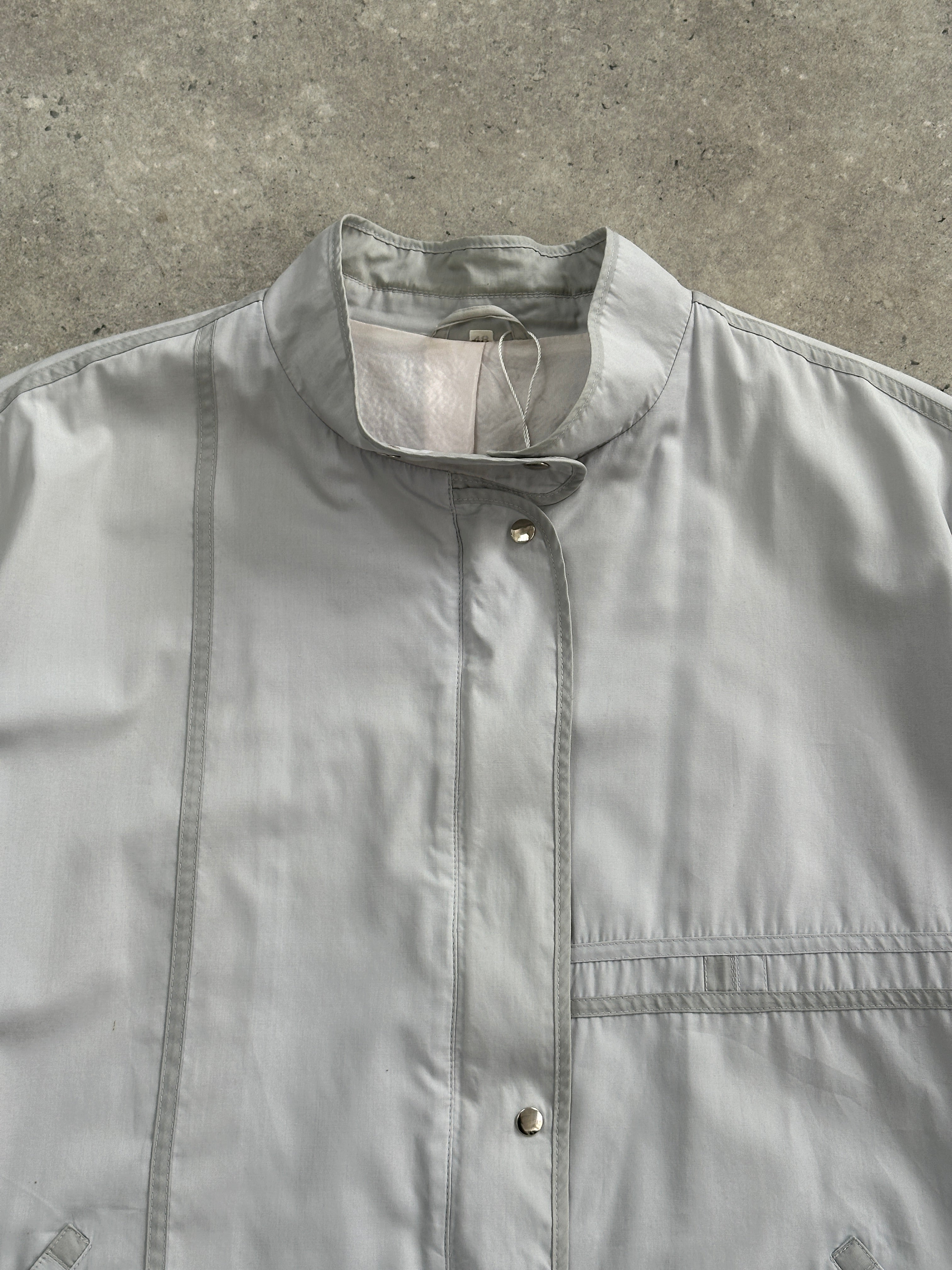 Vintage 2000s high neck bomber jacket in XL, featuring a classic design with a zip front and ribbed cuffs.