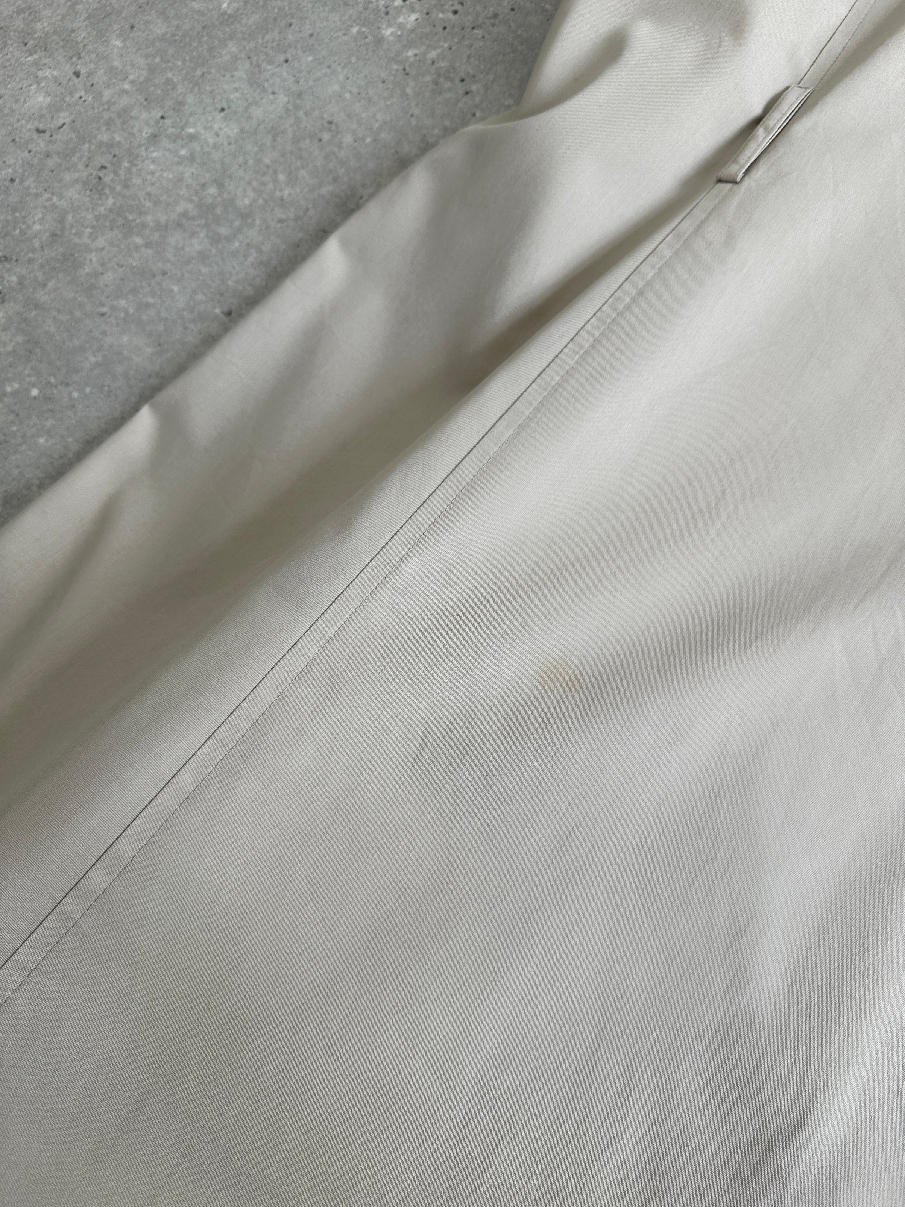 London Fog 1990s double-breasted cotton trench coat in size M, shown in classic beige with belt and lapel details.