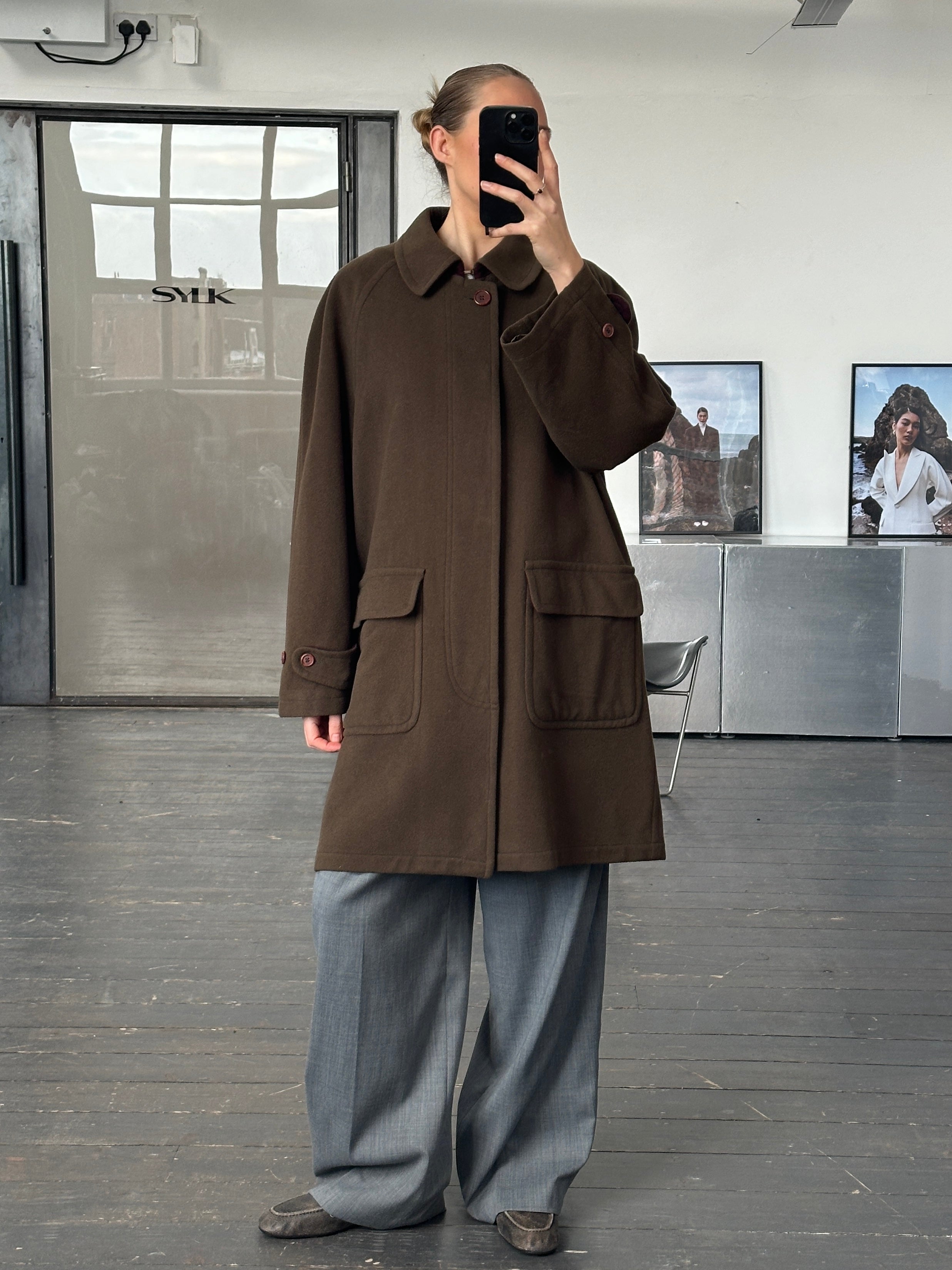 Missoni 1990s wool coat with concealed placket, oversized XXL fit, showcasing a textured knit pattern and classic design.