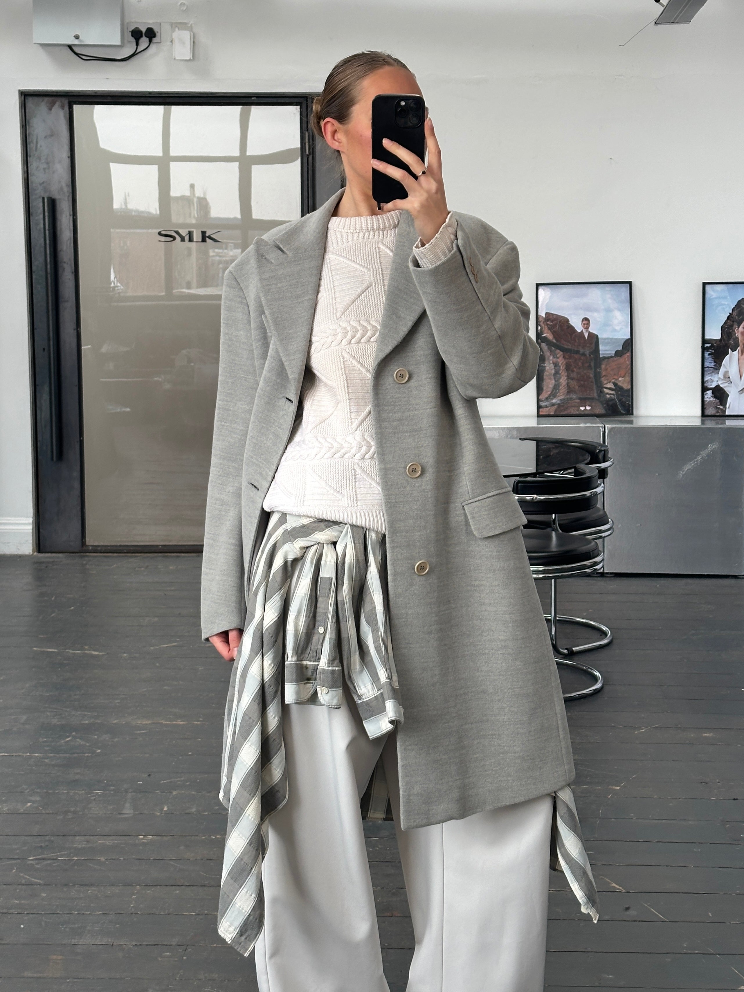 Gianfranco Ferre 1990s wool single-breasted coat in size L, shown hanging with classic tailored design and neutral color.