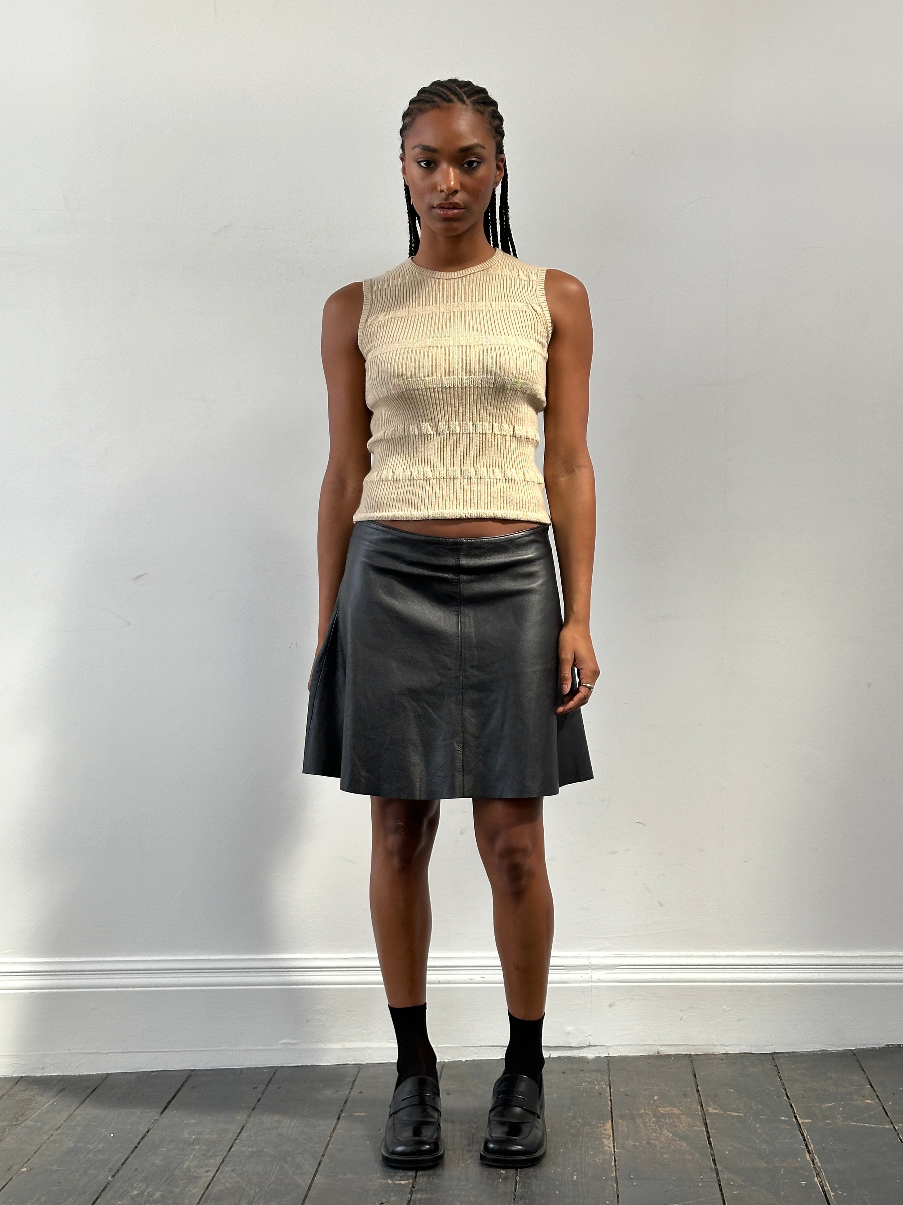 Pinko Italian leather A-line skirt in pink, size W30, shown with smooth leather texture and classic silhouette.