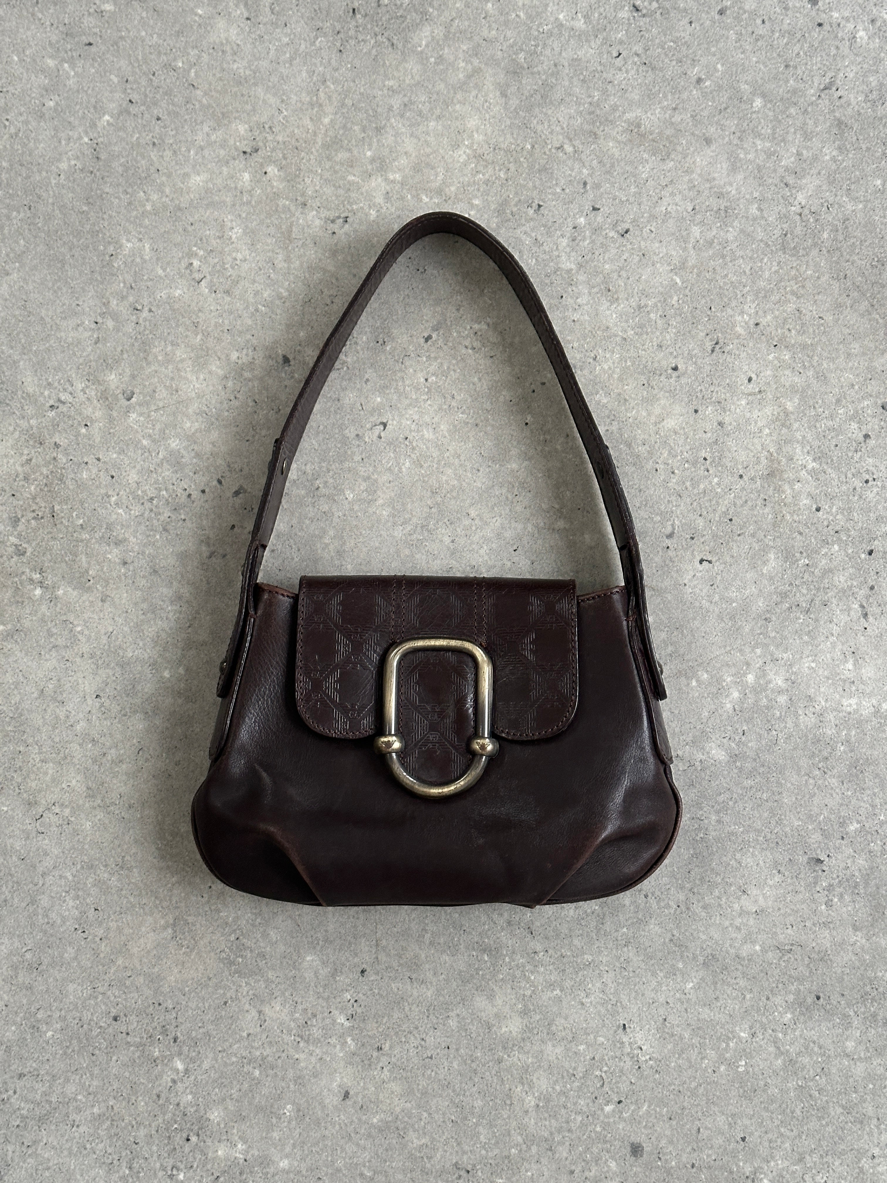 Emporio Armani leather shoulder bag with hardware monogram design, featuring adjustable strap and sleek style.