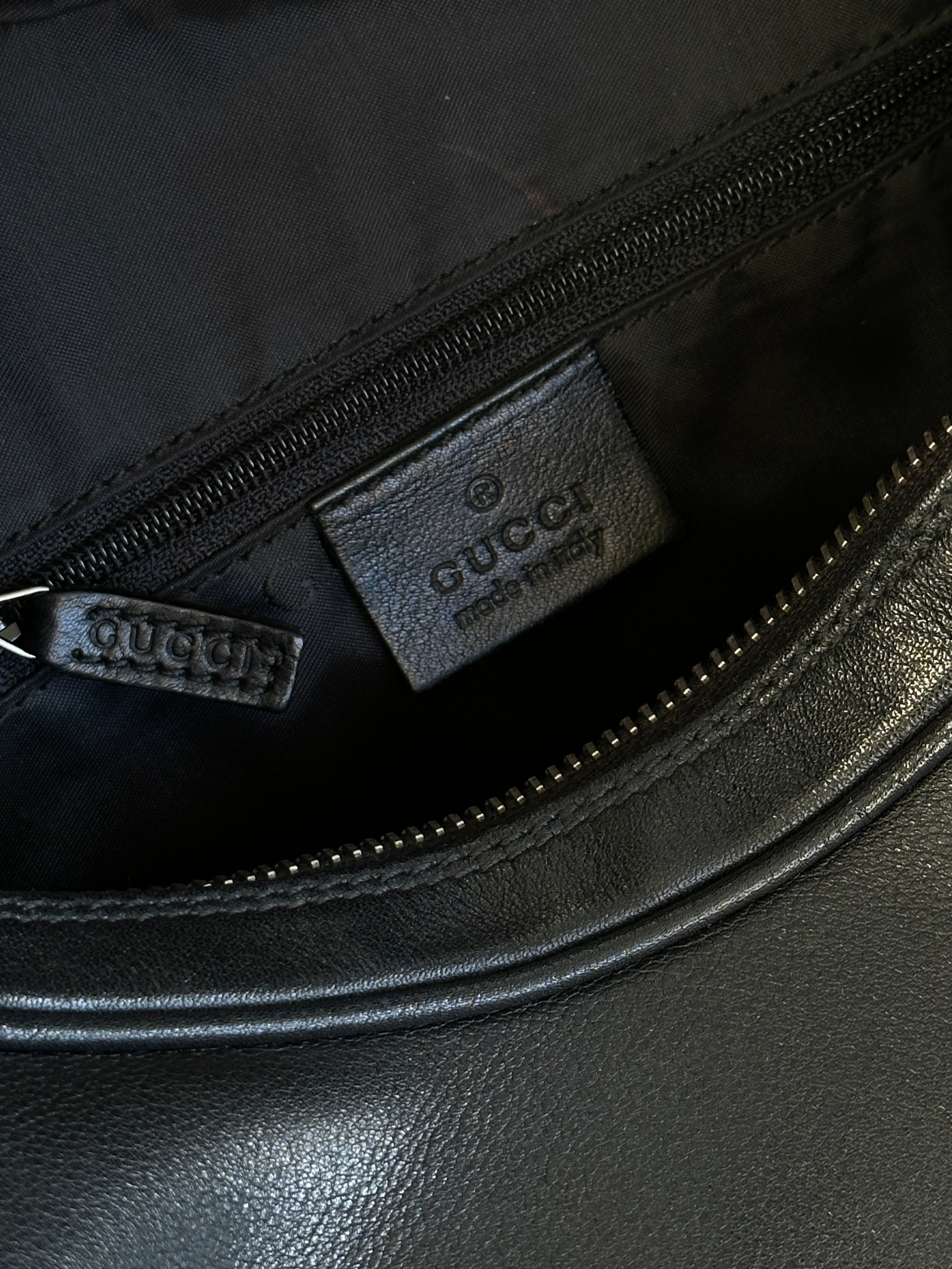 Gucci 1990s Tom Ford GG 3-in-1 leather attaché bag with multiple compartments and classic design.