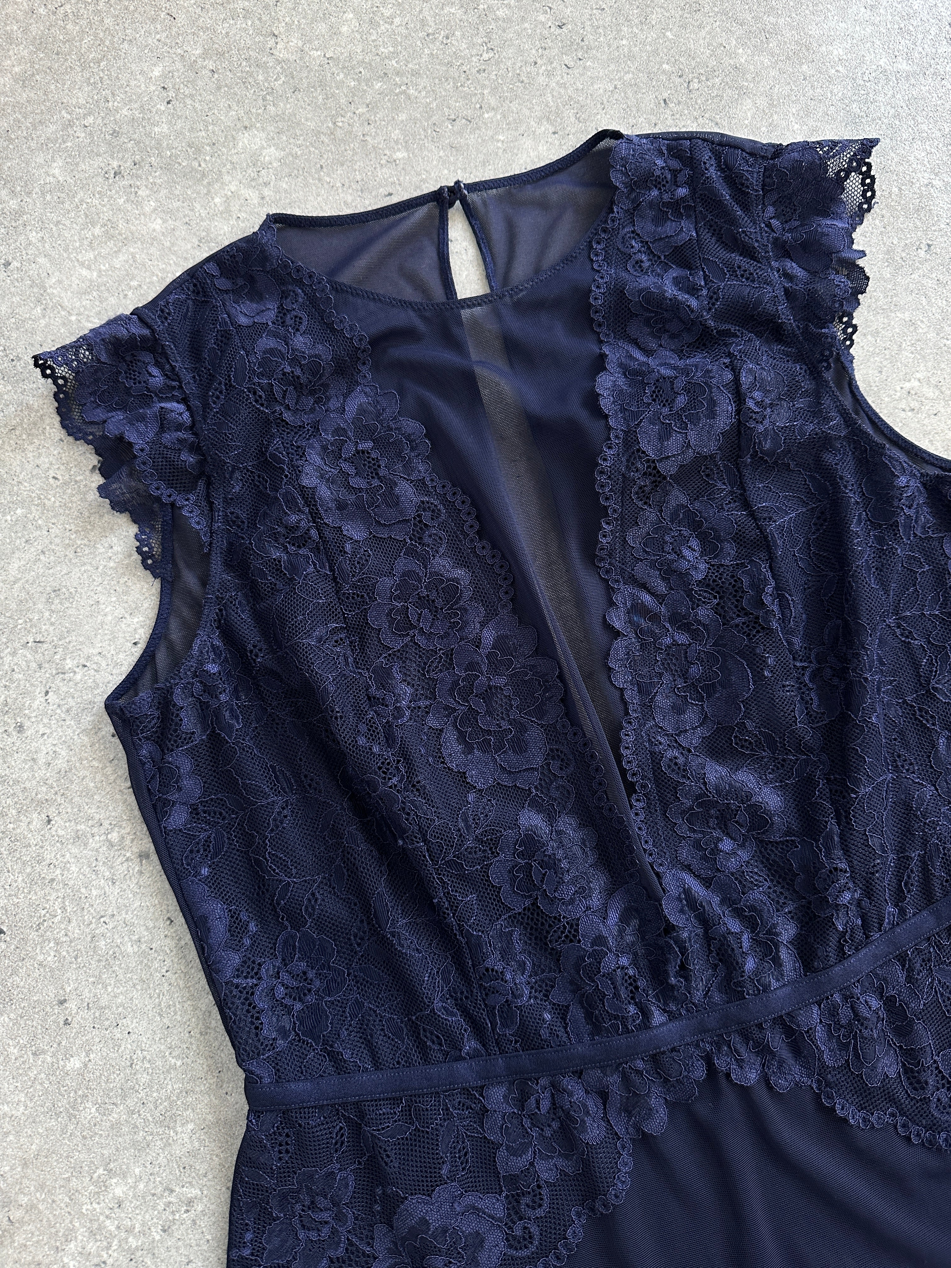 Vintage 2000s lace bodysuit top in size M, featuring intricate lace details and a fitted silhouette.