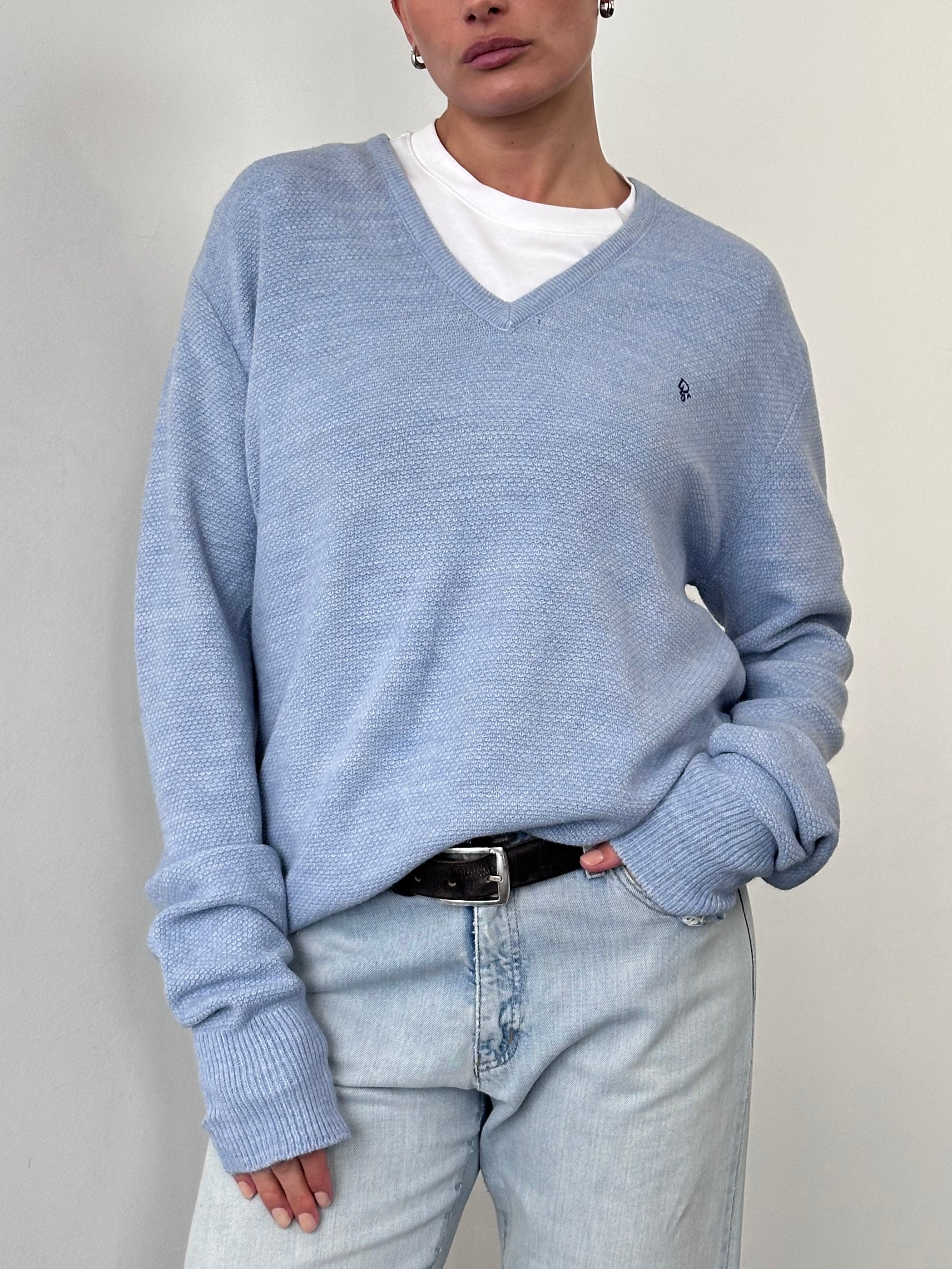 Christian Dior Monsieur V neck logo knitted jumper in size L/XL, navy blue with subtle Dior branding on the chest.