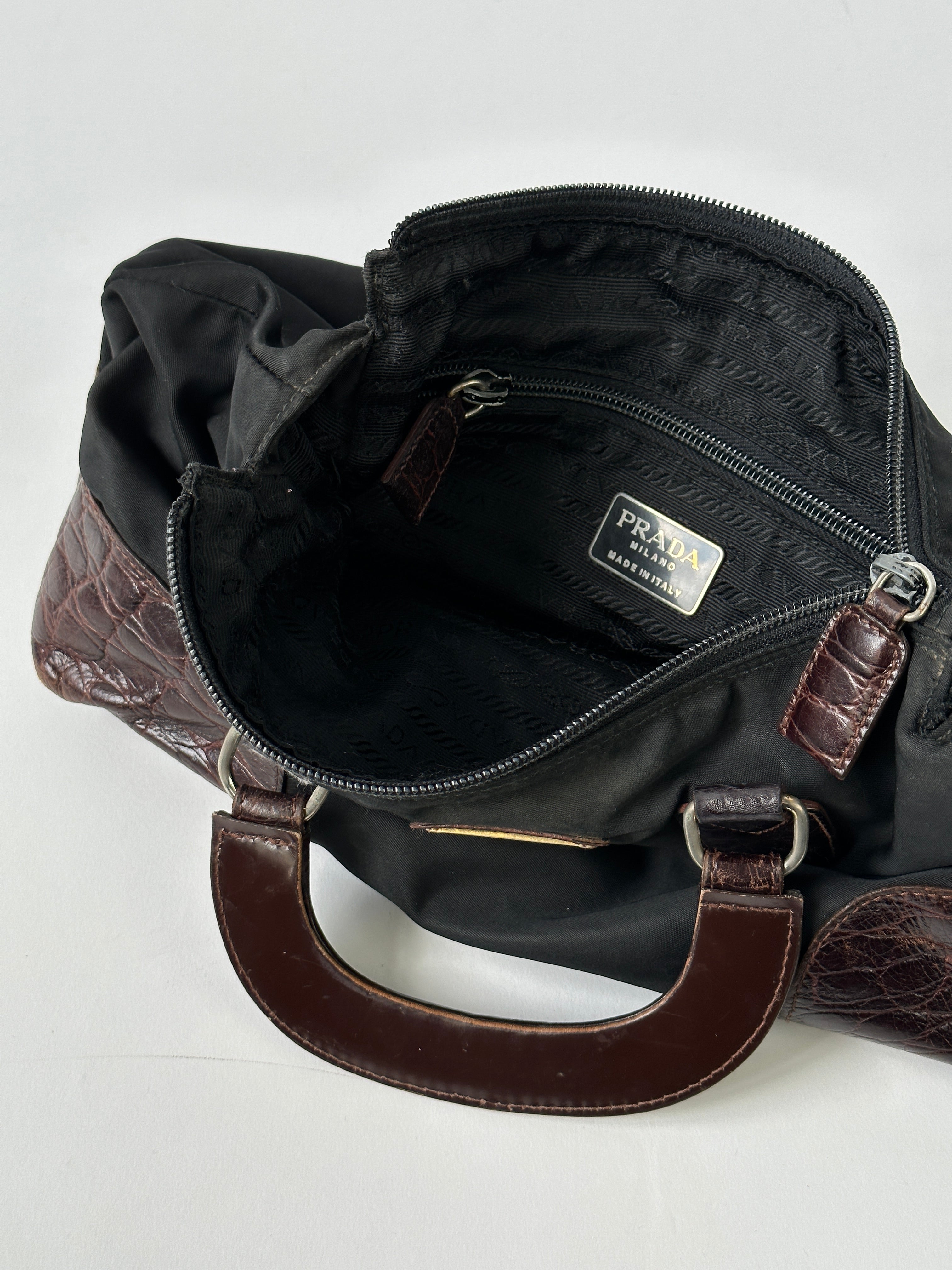 Prada nylon croc handbag featuring sleek design with textured crocodile pattern and sturdy nylon material.