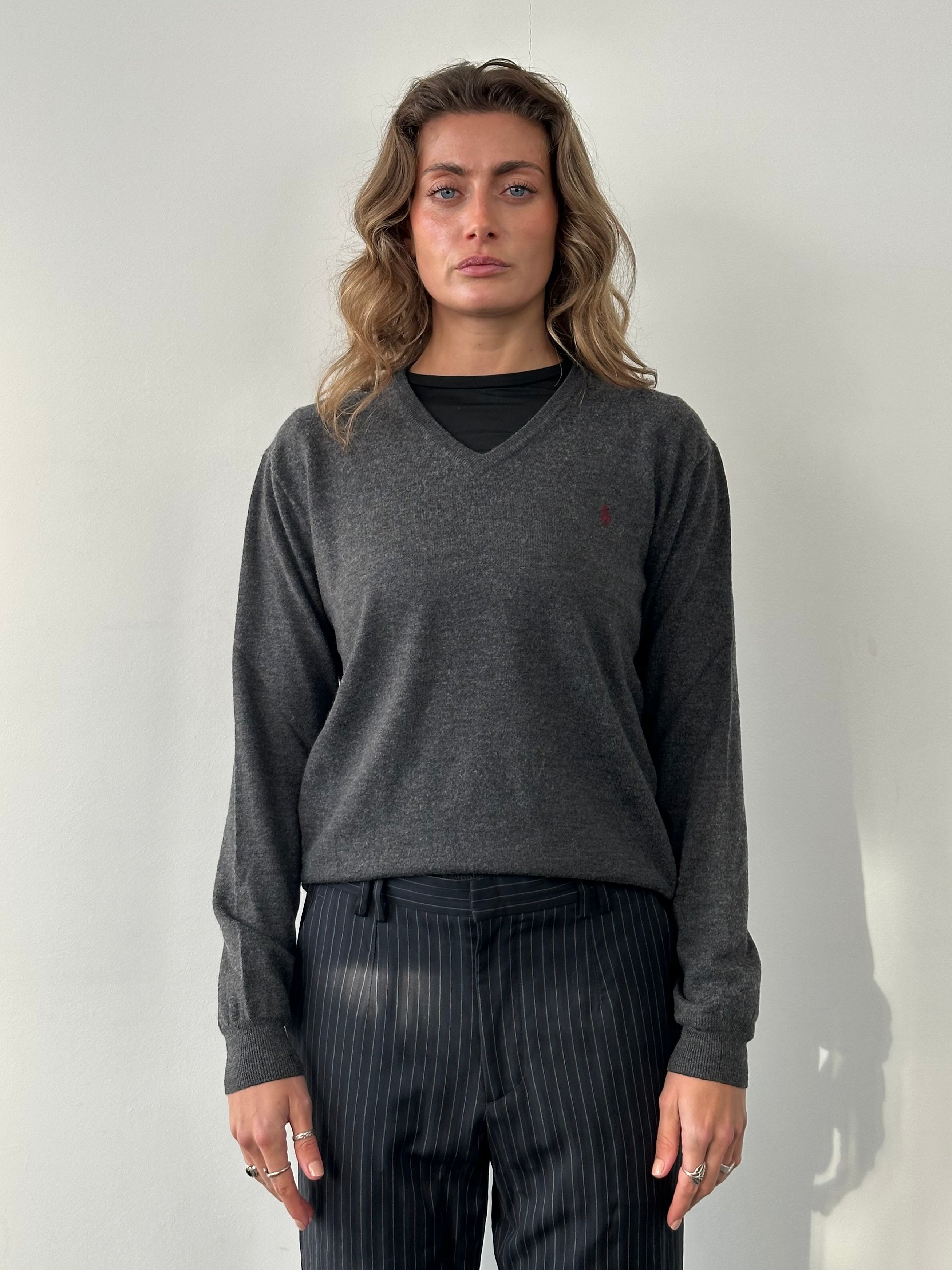 Ralph Lauren Pure Merino Wool V-neck jumper in size M, featuring the brand's logo, in navy blue with a ribbed collar and cuffs.