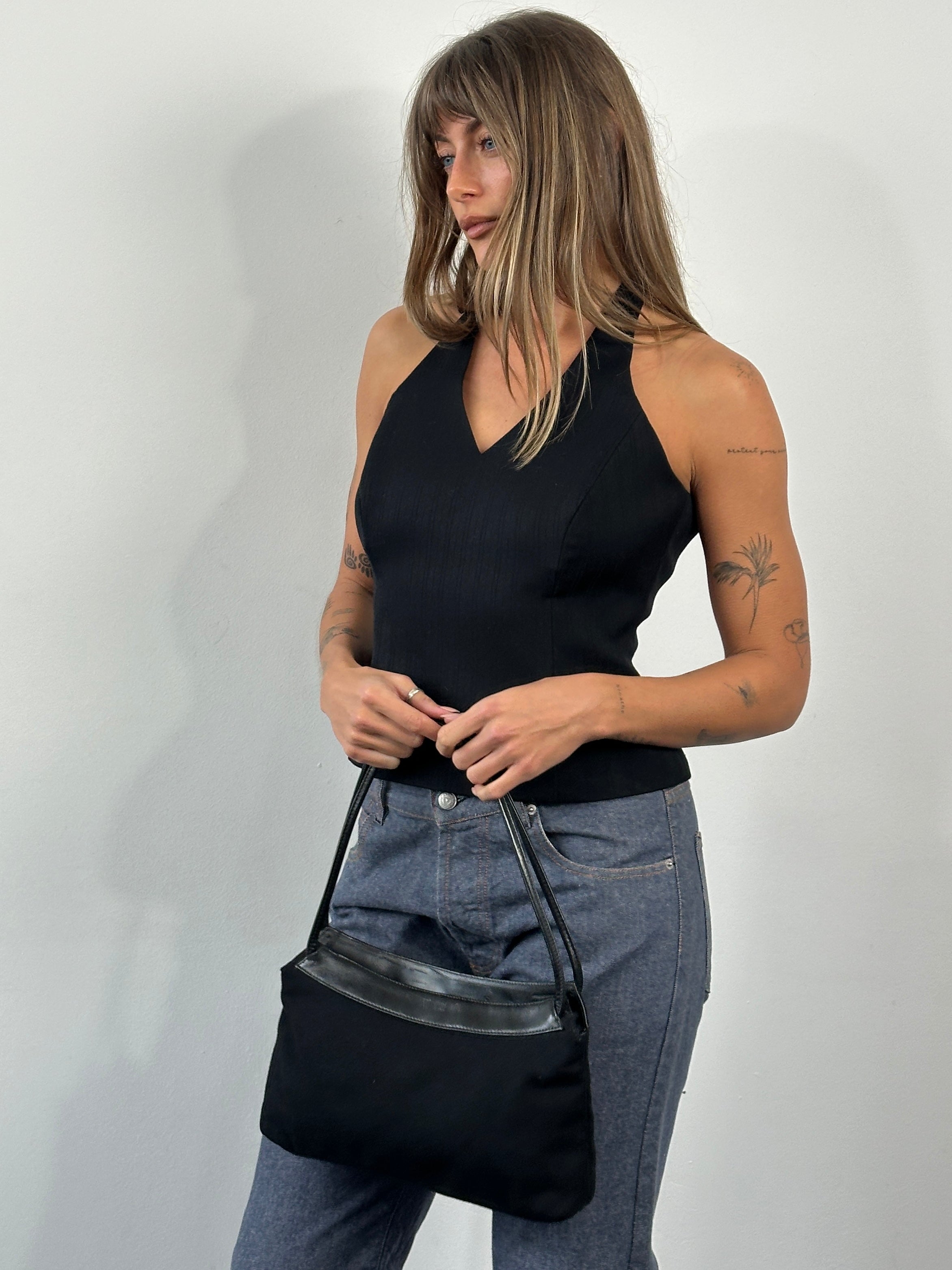 Vintage 2000s structured halterneck tank top in beige with a fitted design and sleeveless style.