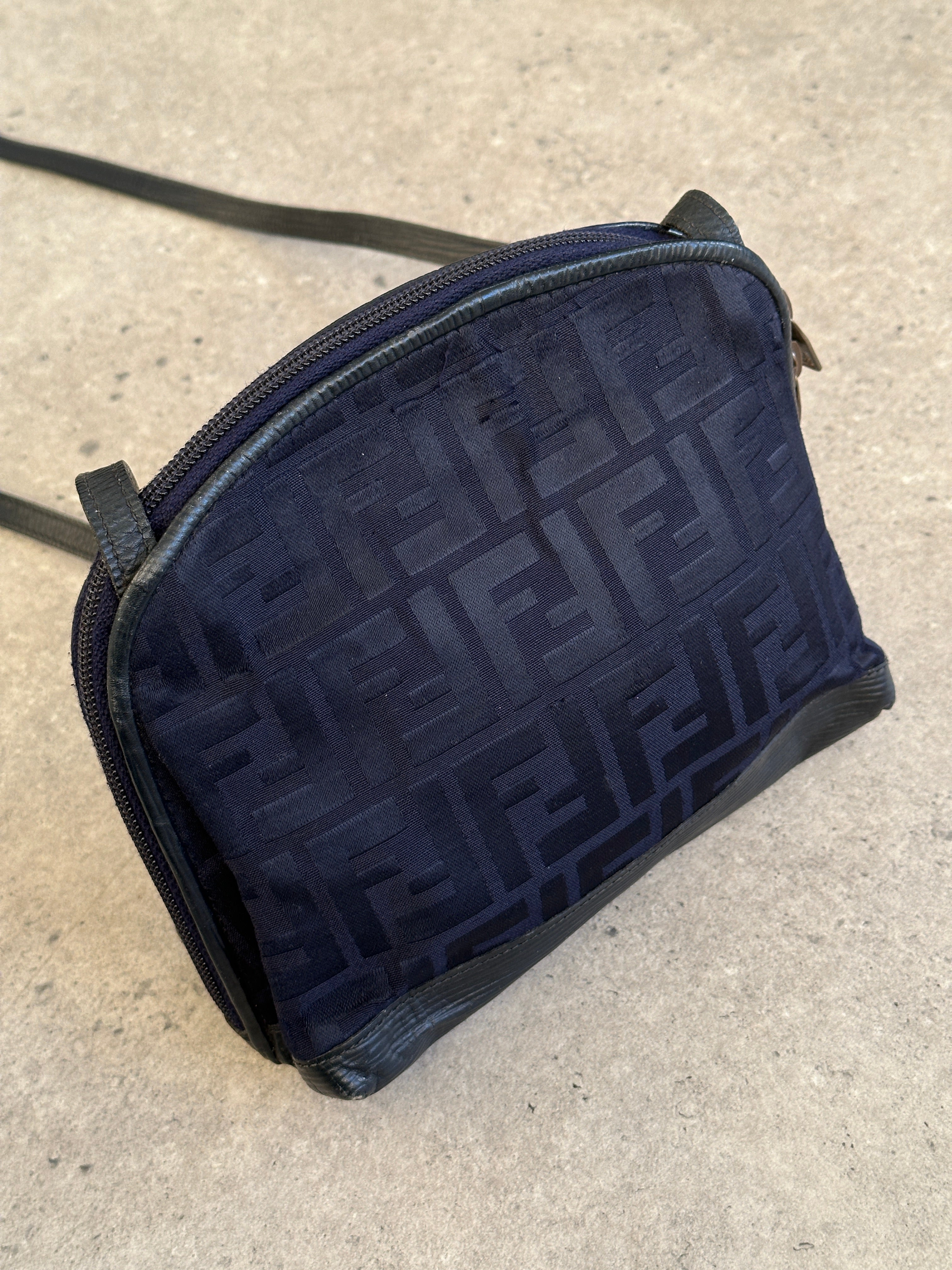 Fendi FF Monogram Crossbody Bag with adjustable strap, featuring signature logo pattern and sleek design.