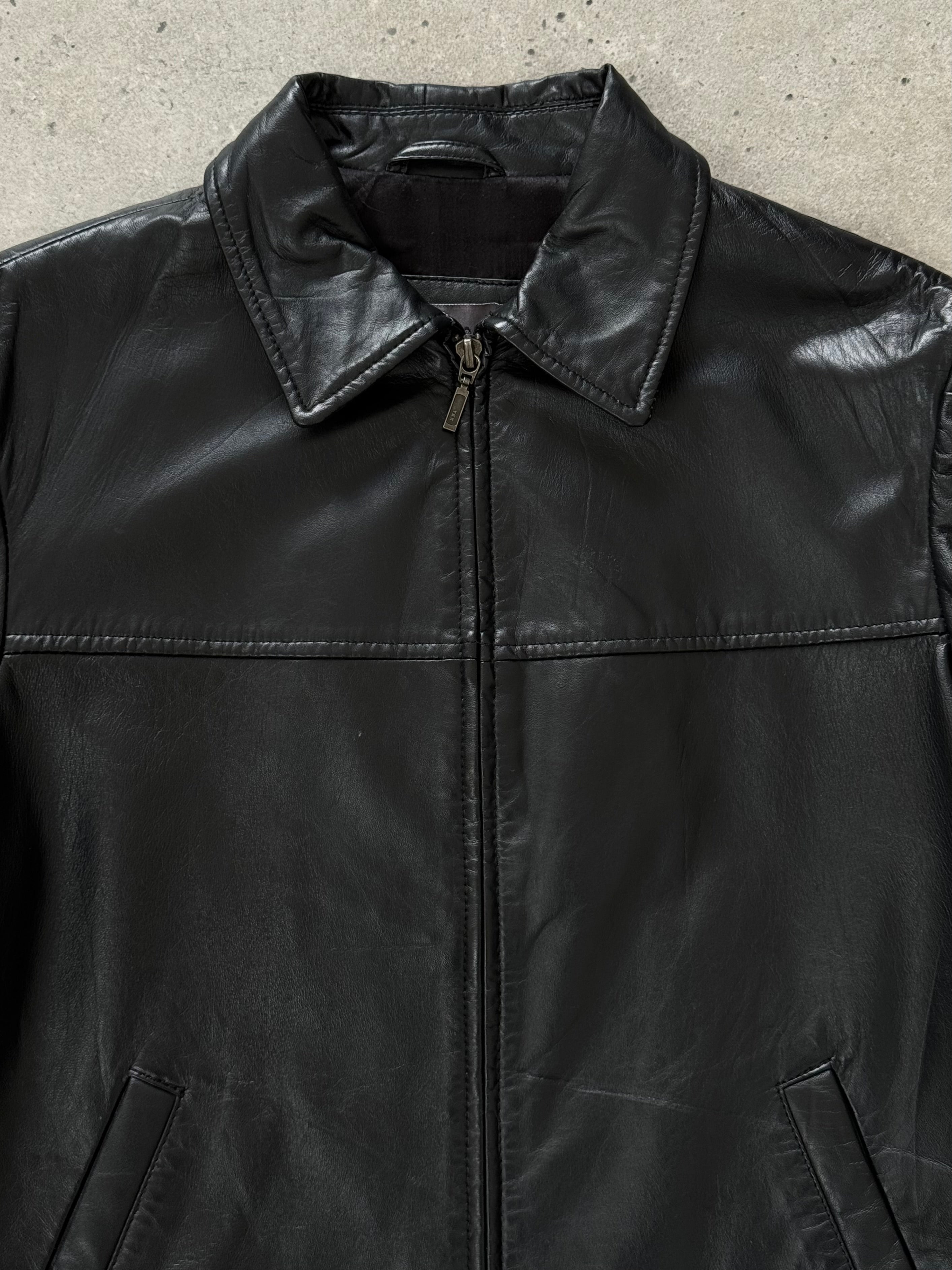 Vintage 1990s smooth leather cropped jacket, size small, featuring a classic design and sleek texture.