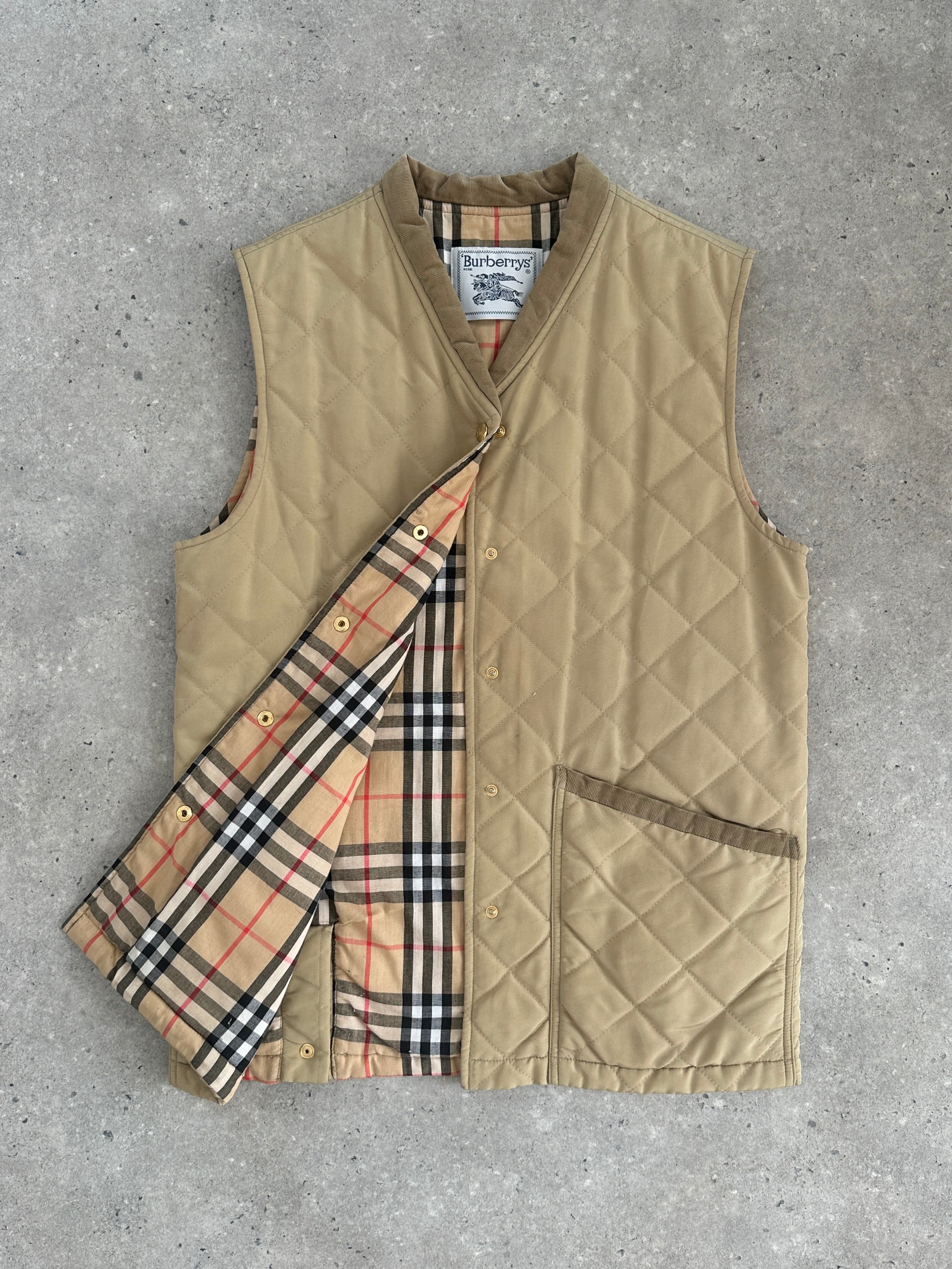 Burberry 1990s nylon bespoke button Nova Check gilet in size M, featuring the classic check pattern and front button closure.