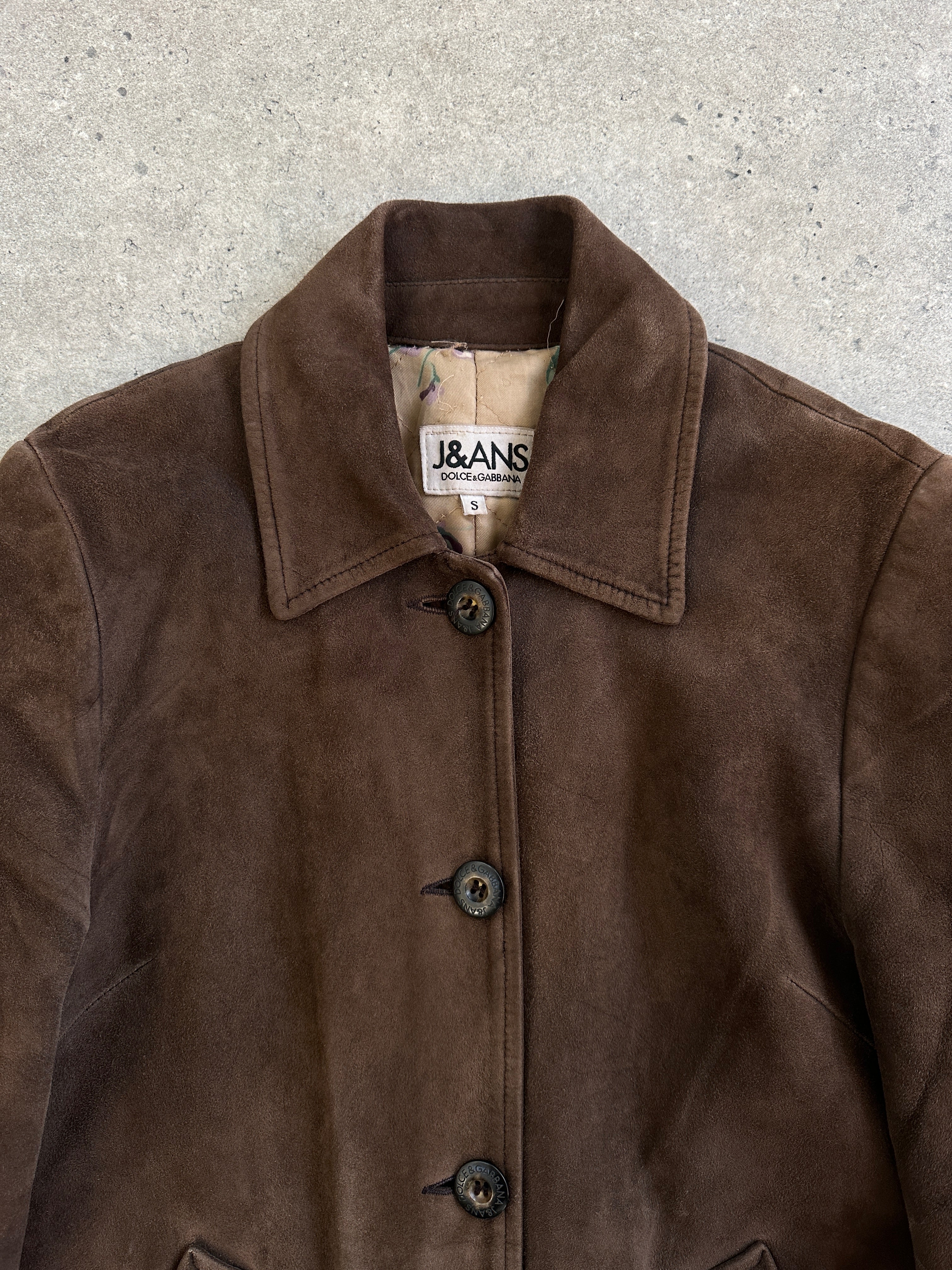 Dolce & Gabbana 1990s suede leather jacket in size S, featuring classic design and rich texture, shown on a hanger.