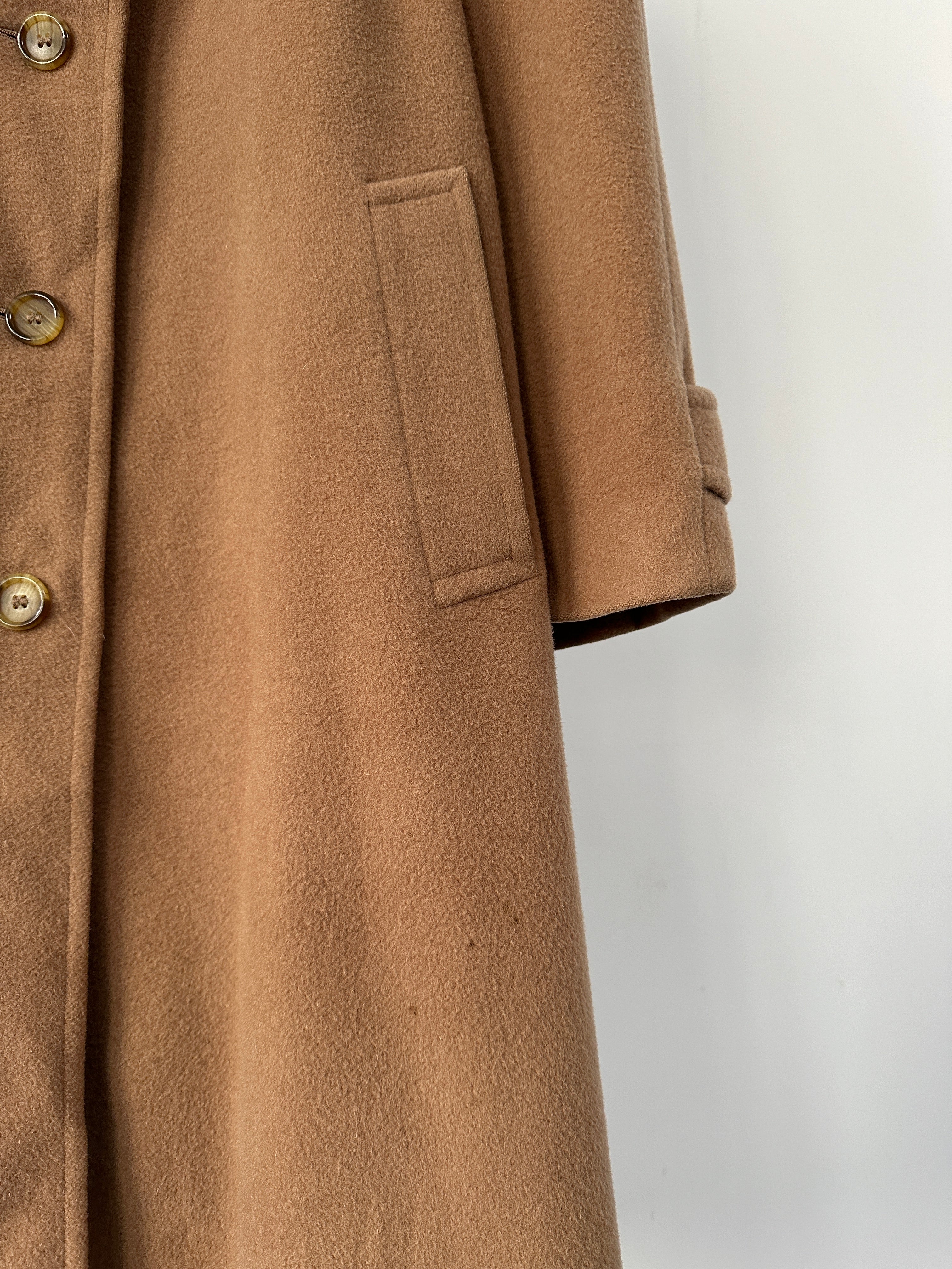 Burberry wool camel hair single-breasted coat in size L displayed on a hanger. Classic design with a tailored fit.