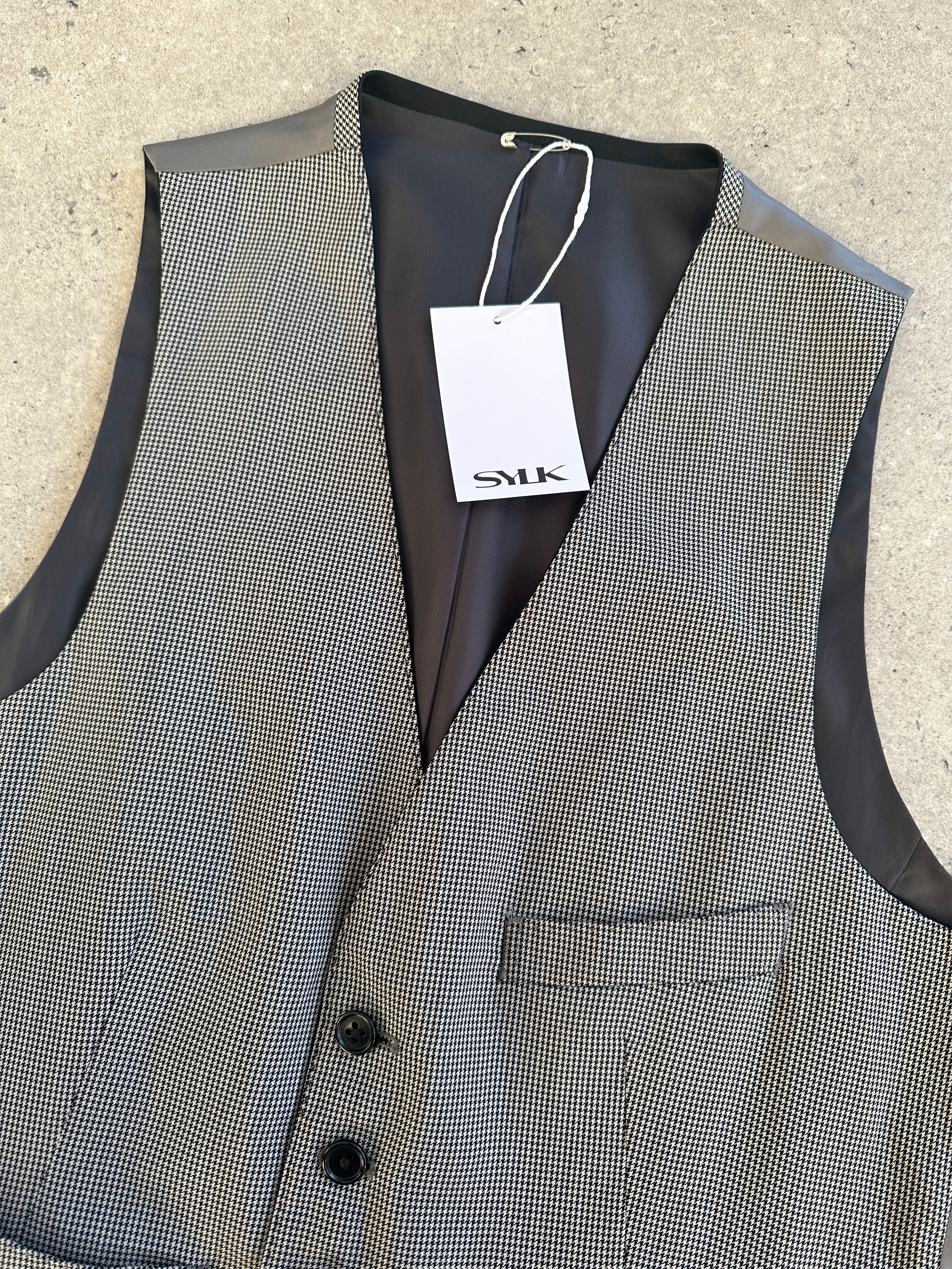 Vintage reversible wool tailored waistcoat in size M, showing front and back views with classic design and detailed stitching.