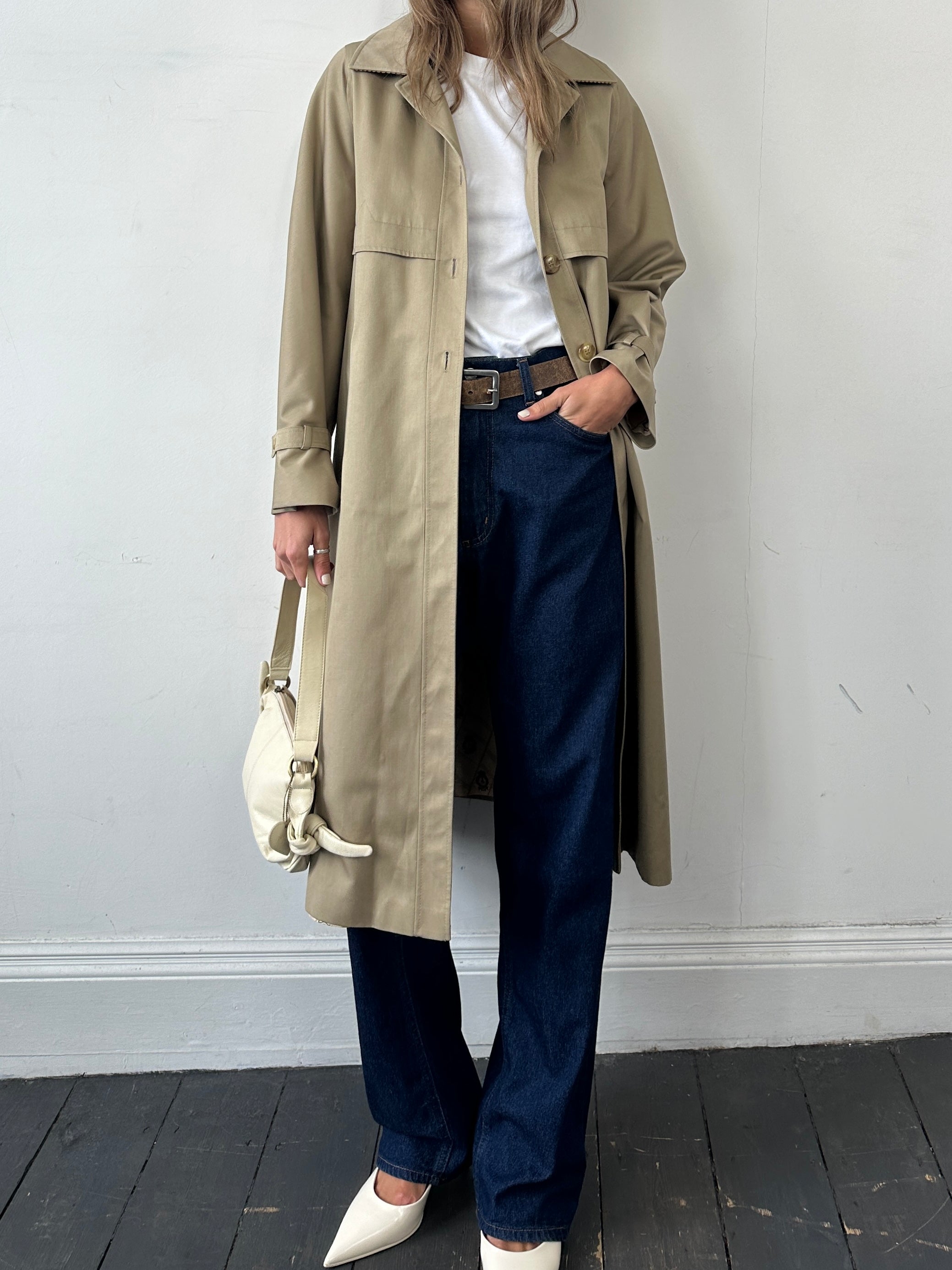 Vintage single breasted trench coat in size S, classic beige color, stylish button details, and tailored fit shown in the image.