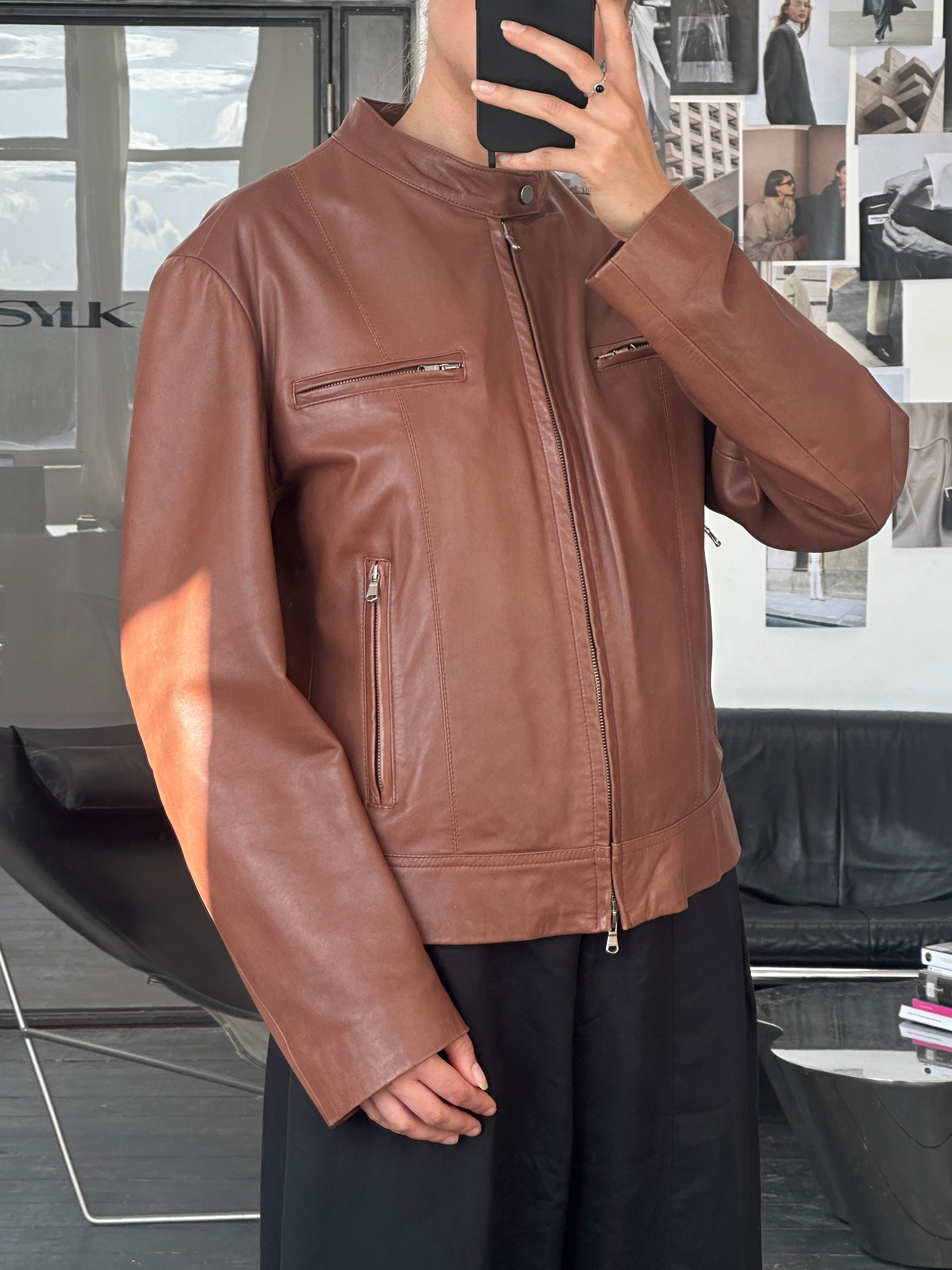 Vintage Italian 90s double zip moto leather jacket, M/L size, featuring classic design and authentic distressed leather details.