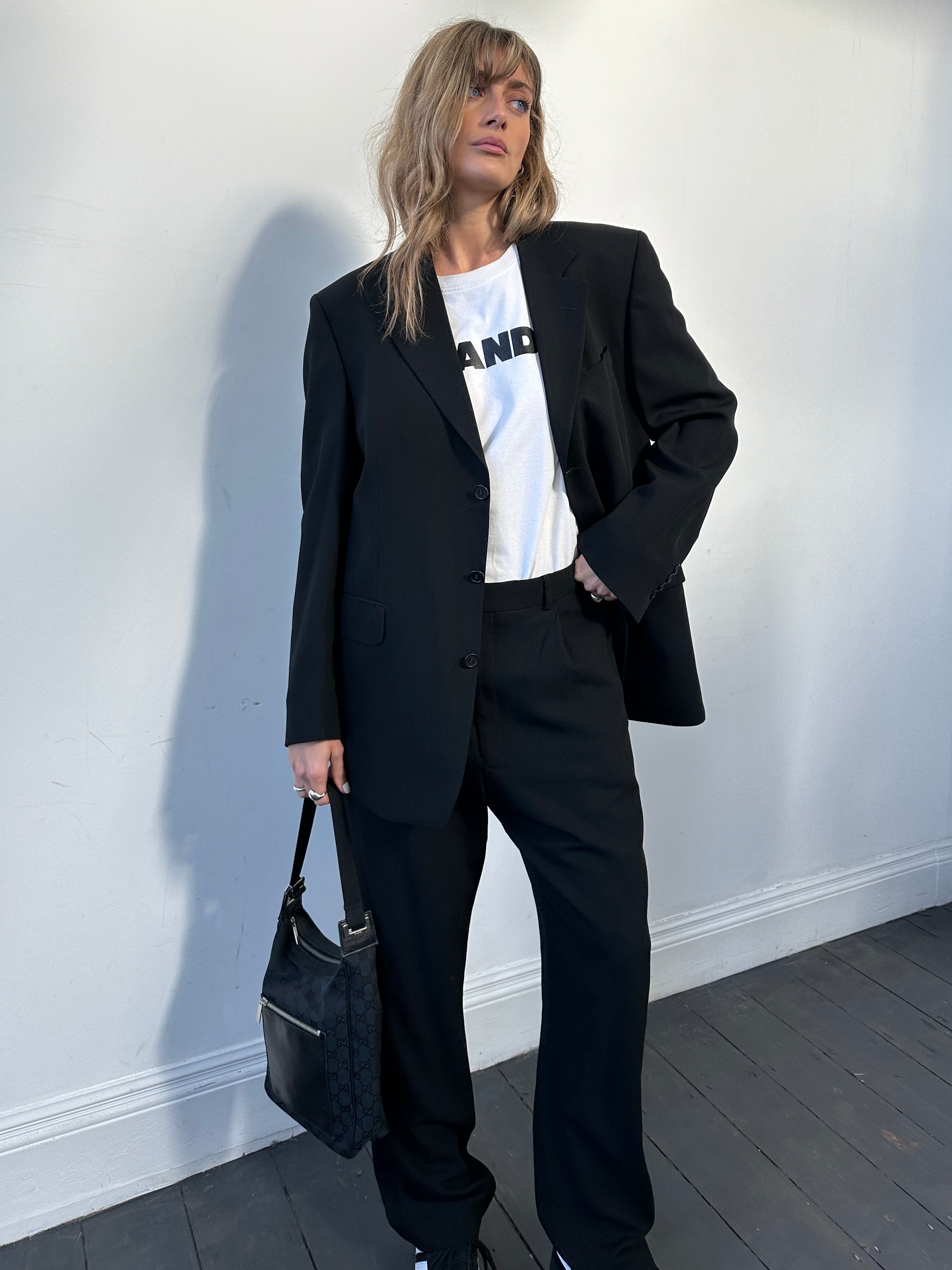 Yves Saint Laurent pure wool jumpsuit in size 42R/W32, tailored fit with classic design and sleek silhouette.