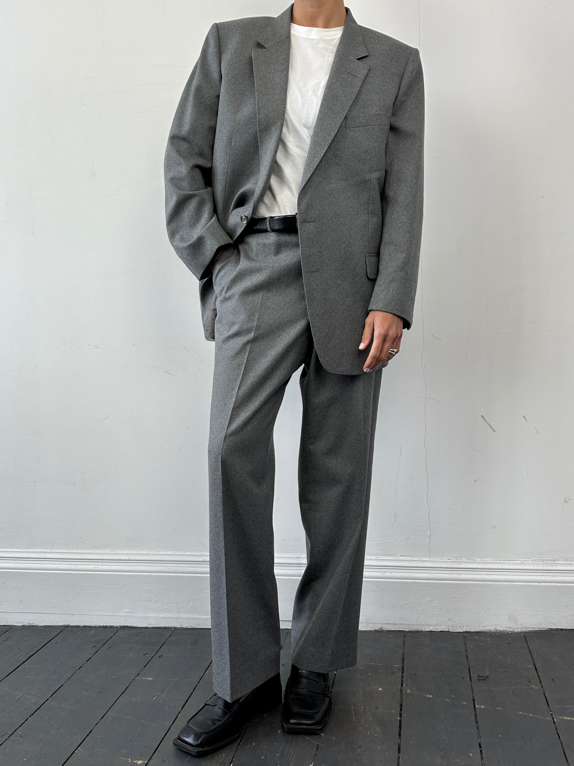 Christian Dior pure wool single-breasted suit jumpsuit in size 44R/W32, shown in a tailored, elegant style.