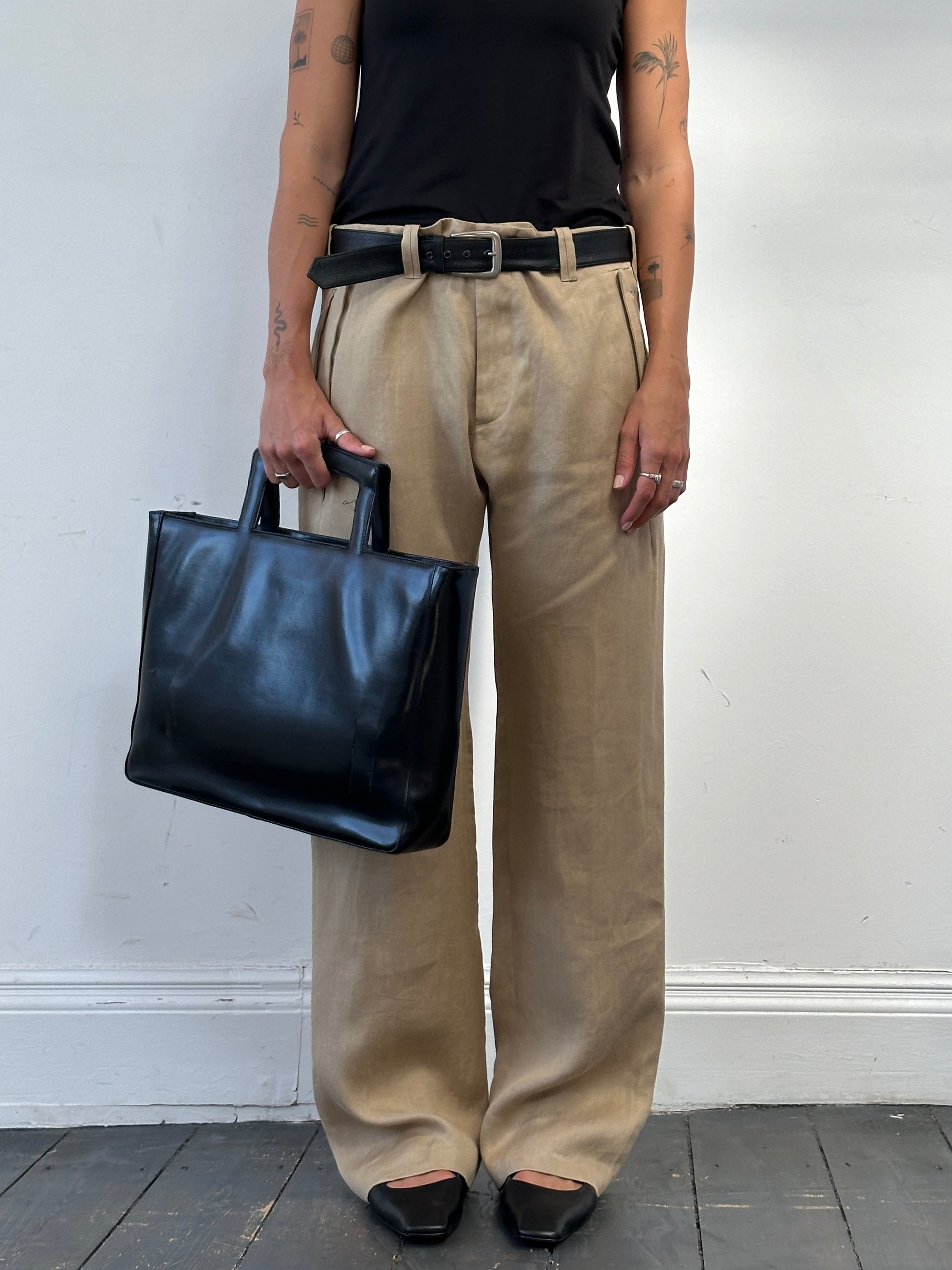 Versace 1990s pure ramie wide-leg trousers in W34 laid flat, showcasing the fabric and classic design.