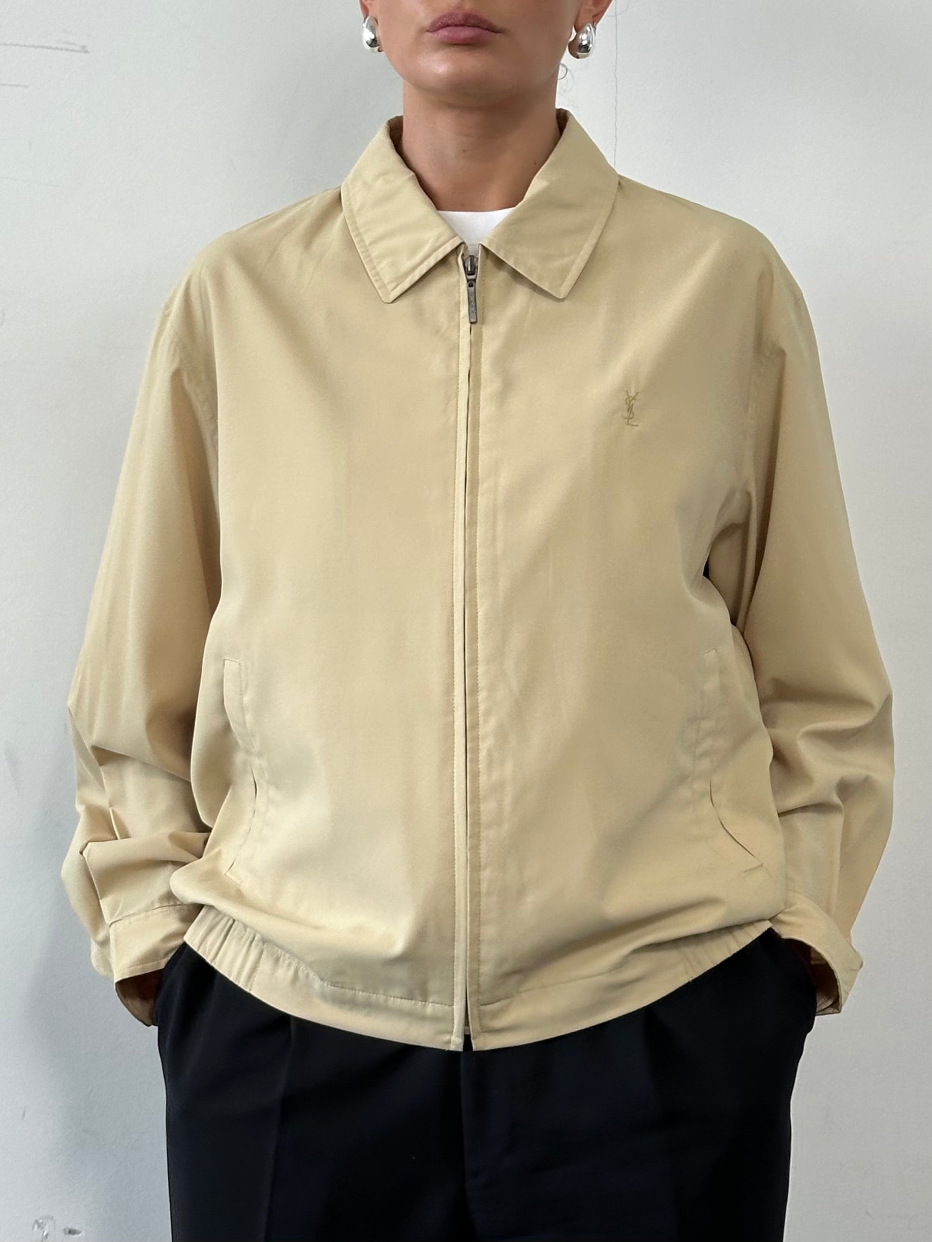 Yves Saint Laurent Pour Homme logo bomber jacket in size M/L, black with YSL branding on the chest and ribbed cuffs.
