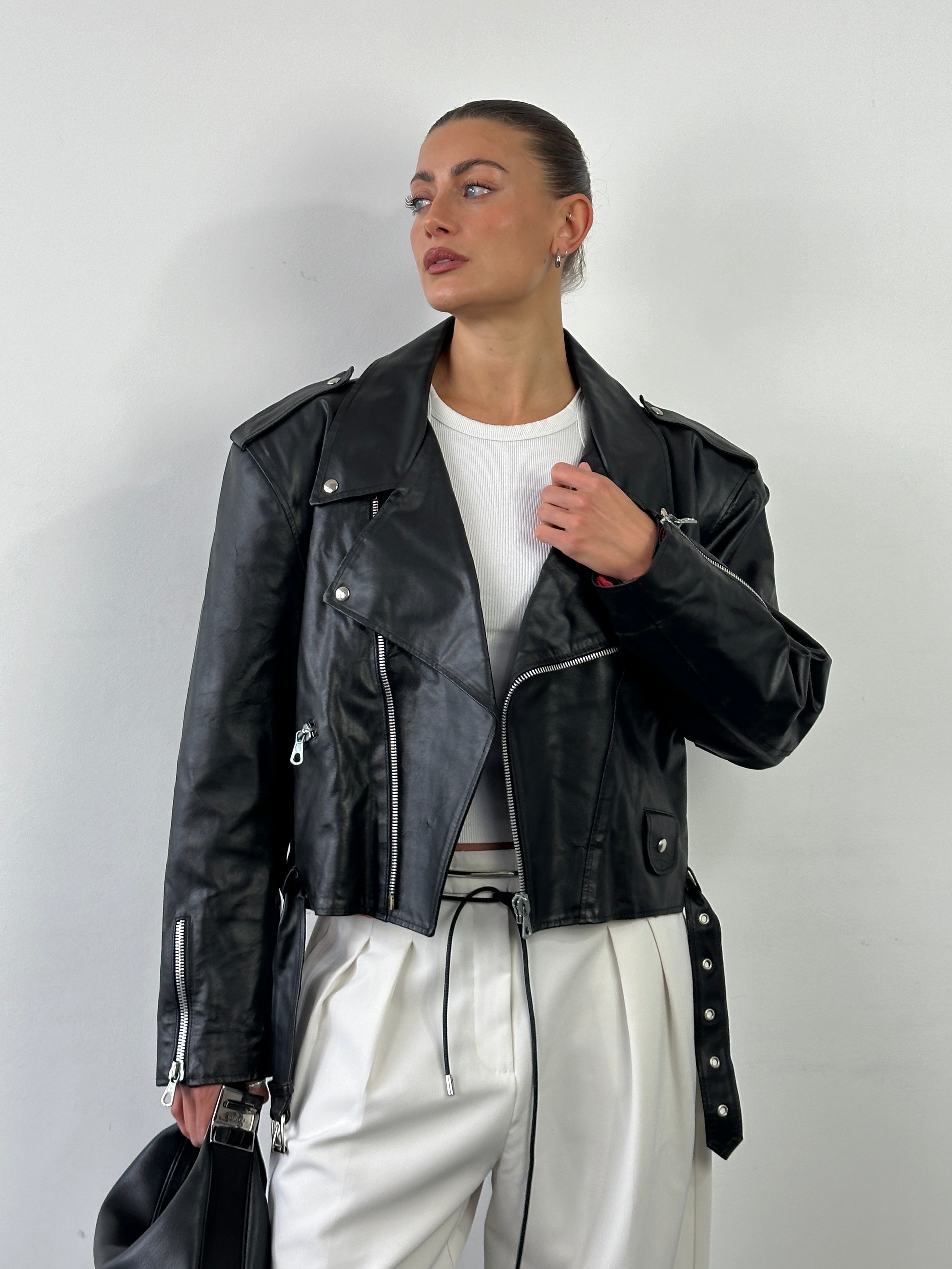 Vintage Italian vintage cropped leather biker jacket, size large, featuring classic motorcycle style and authentic distressed leather.