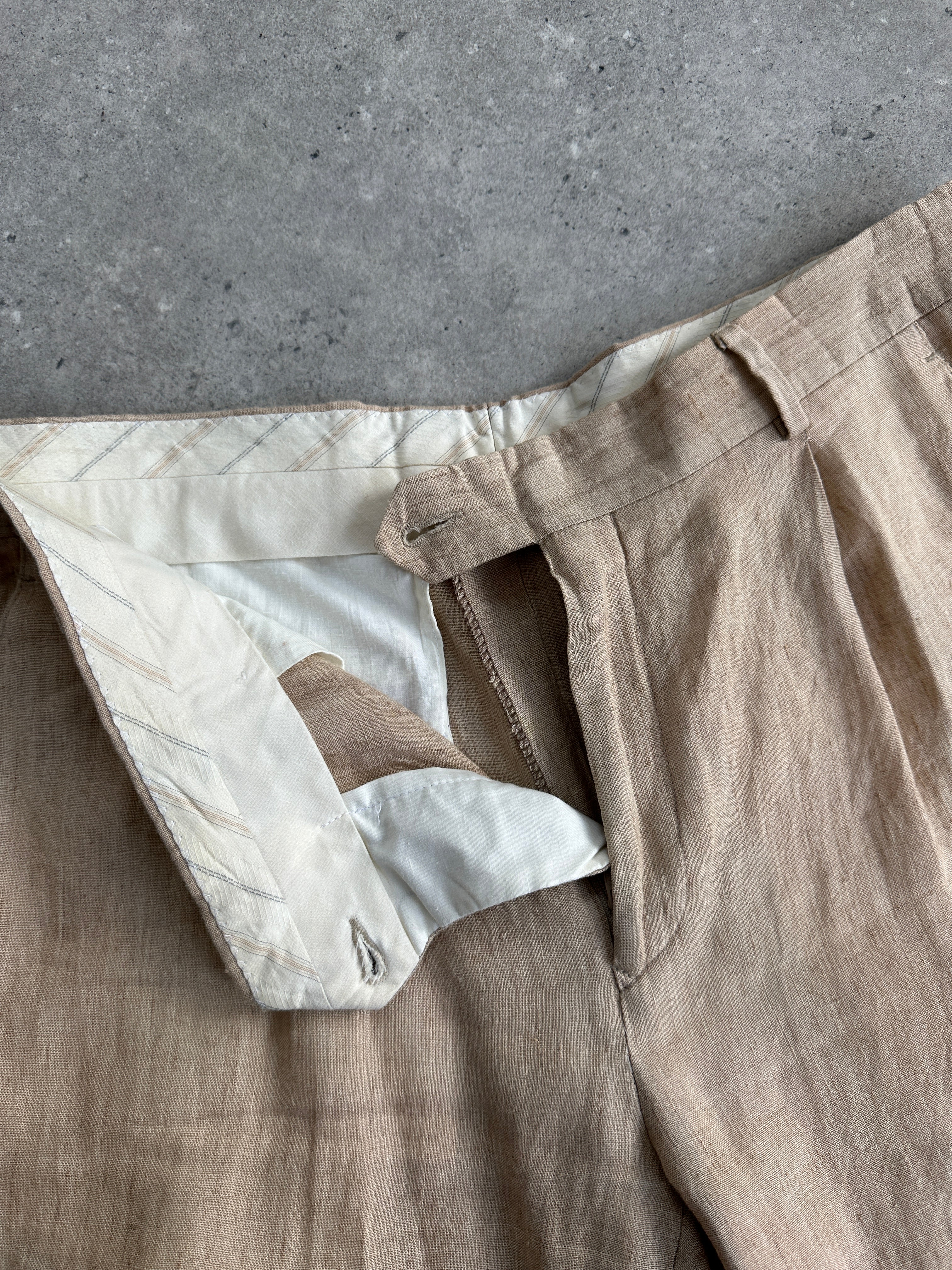 Vintage pure linen straight leg pleated trousers in W32, showing the tailored fit and classic design with a neutral color.