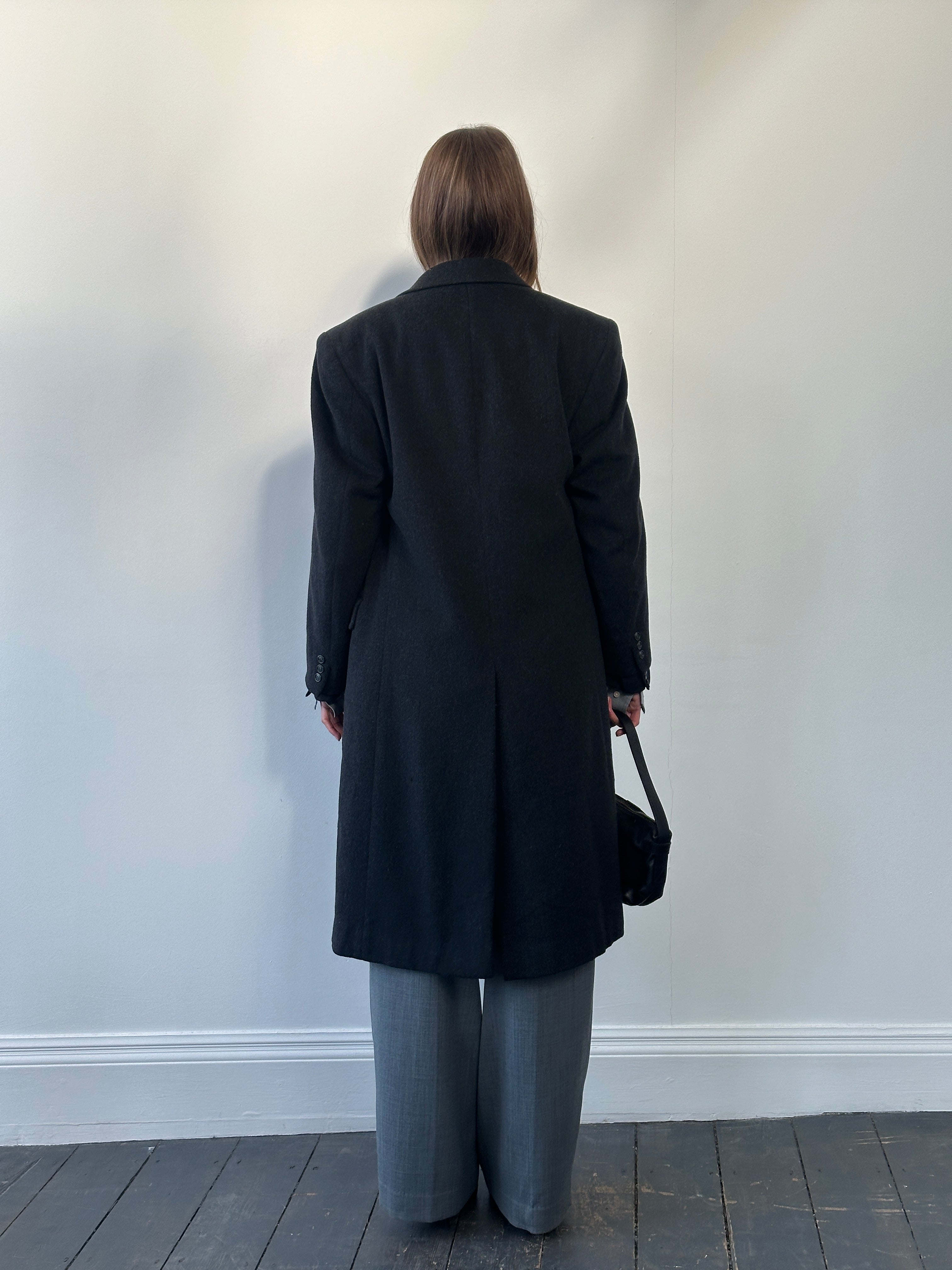 Vintage 1980s pure wool double-breasted coat in size large, classic style with tailored lapels and button details.