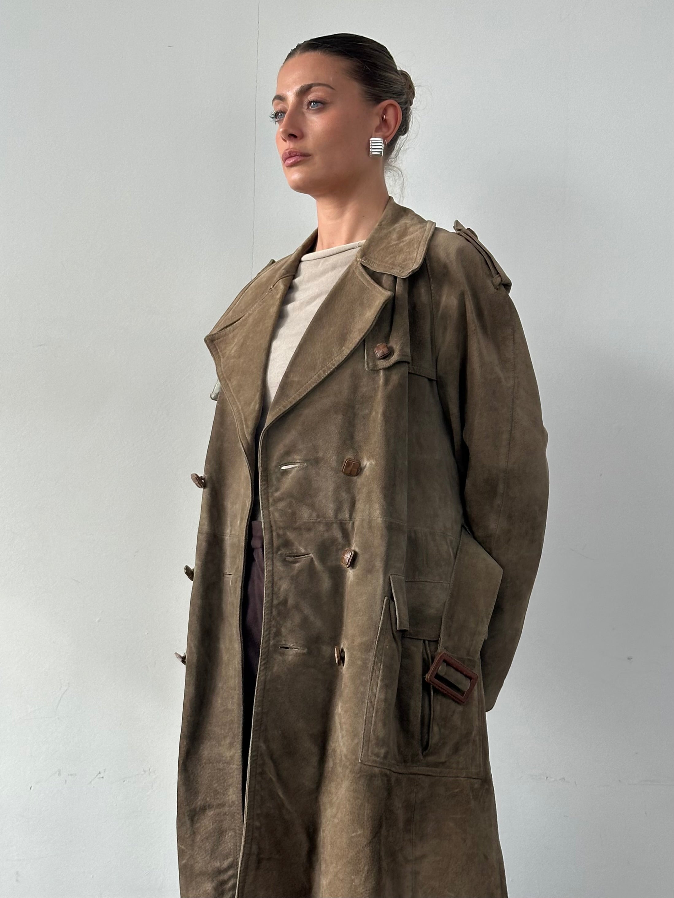Vintage pure suede belted trench coat in XL, featuring classic design and textured suede fabric, displayed on a hanger.