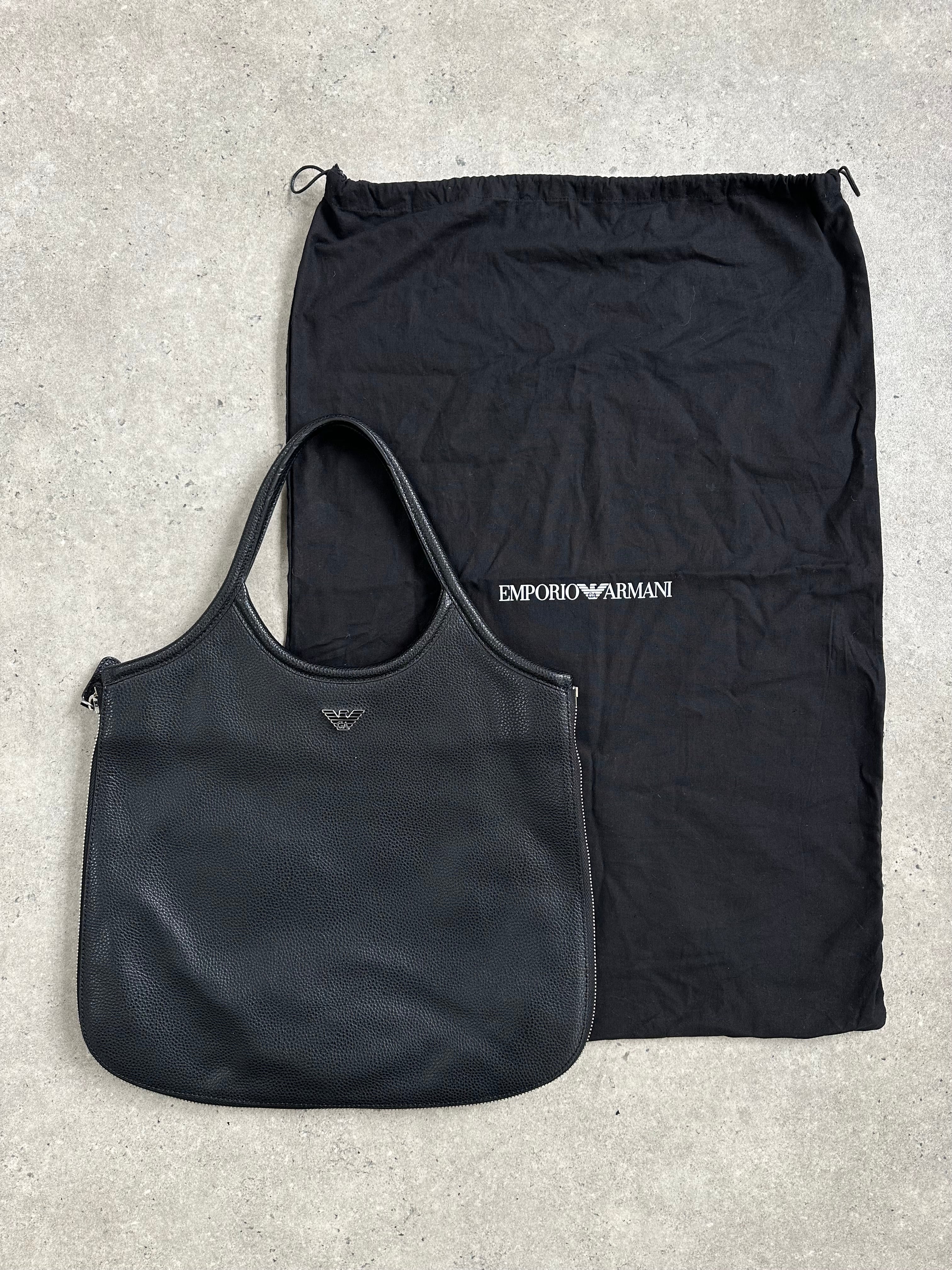 Emporio Armani 1990s leather shoulder bag with sleek design and structured silhouette, featuring a top handle and adjustable strap.