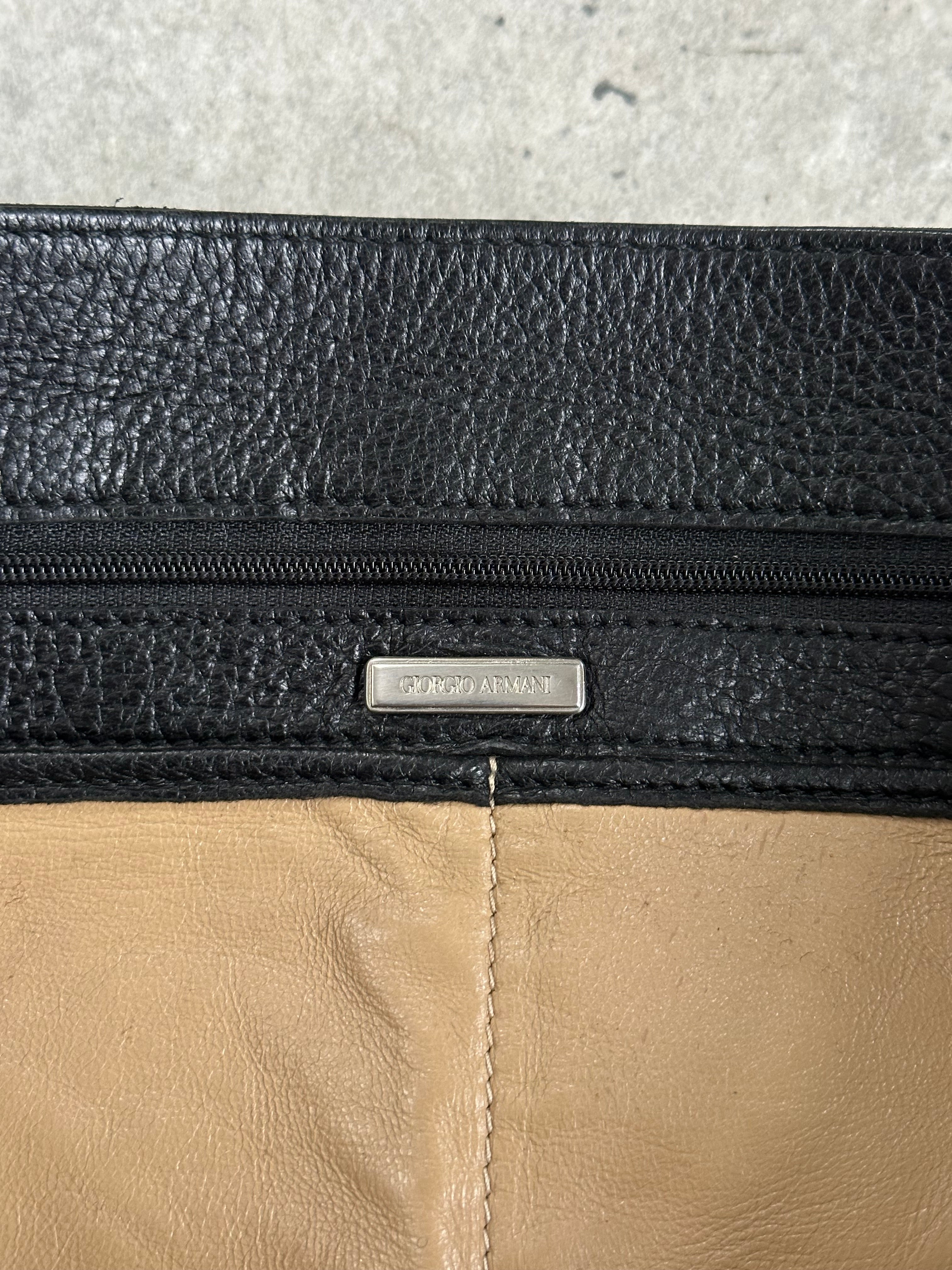 Giorgio Armani 2000s leather crossbody bag with sleek design and adjustable strap, featuring subtle branding and classic style.