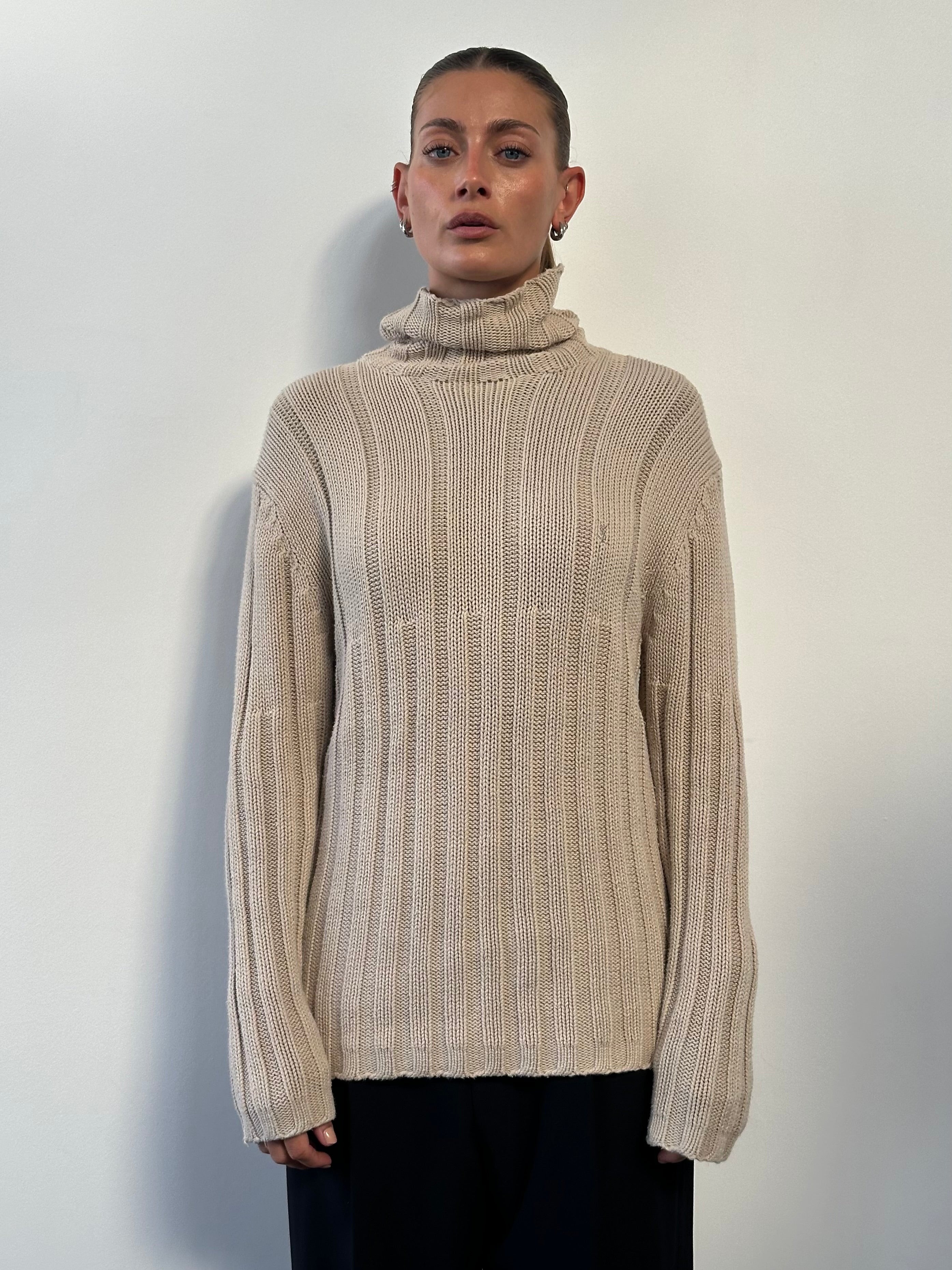 Yves Saint Laurent Pour Homme pure cotton logo roll neck jumper in black, featuring the brand's logo on the chest and a ribbed collar.