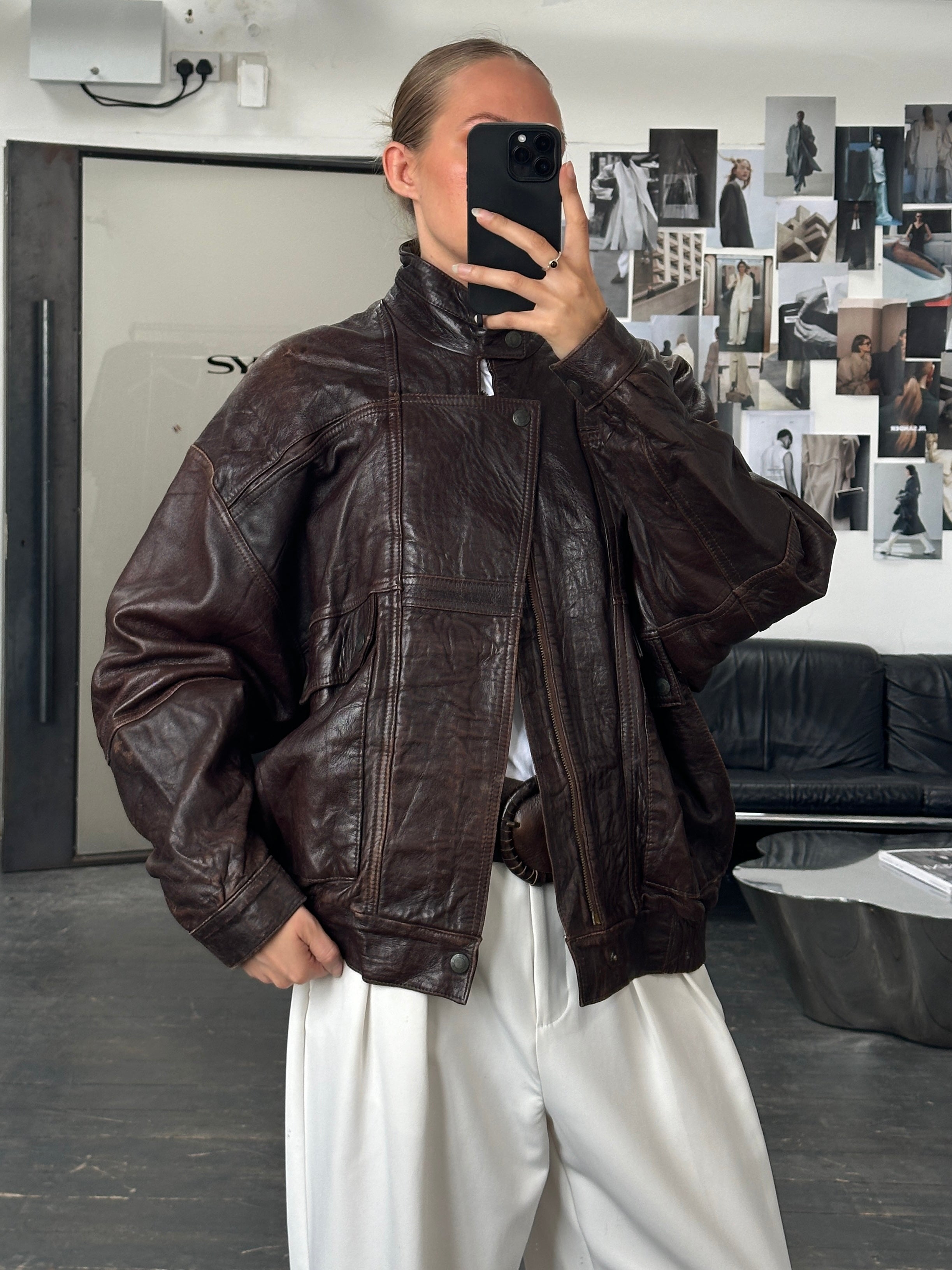 Vintage 1970s high neck moto leather bomber jacket in black, size XL, featuring classic stitching and a rugged, stylish design.