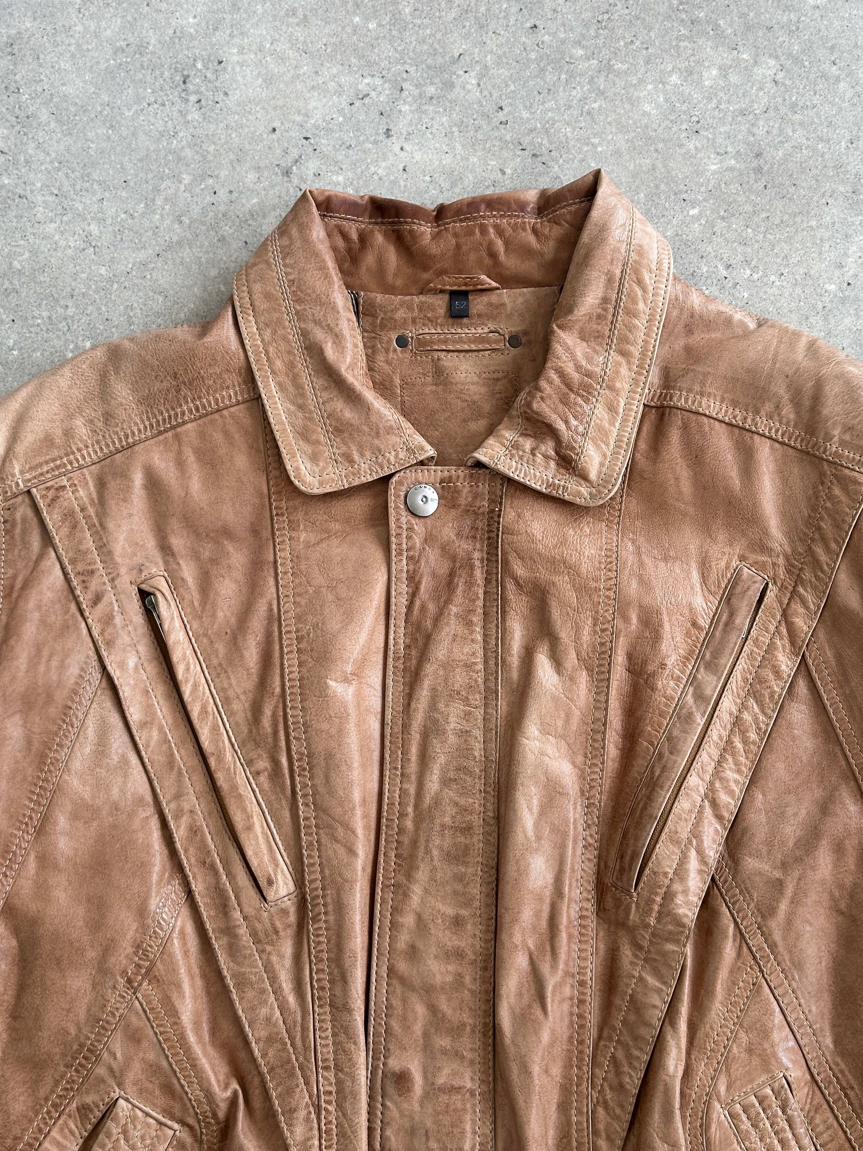 Vintage 1990s leather bomber jacket in size large, featuring classic design with ribbed cuffs and collar, brown leather exterior.