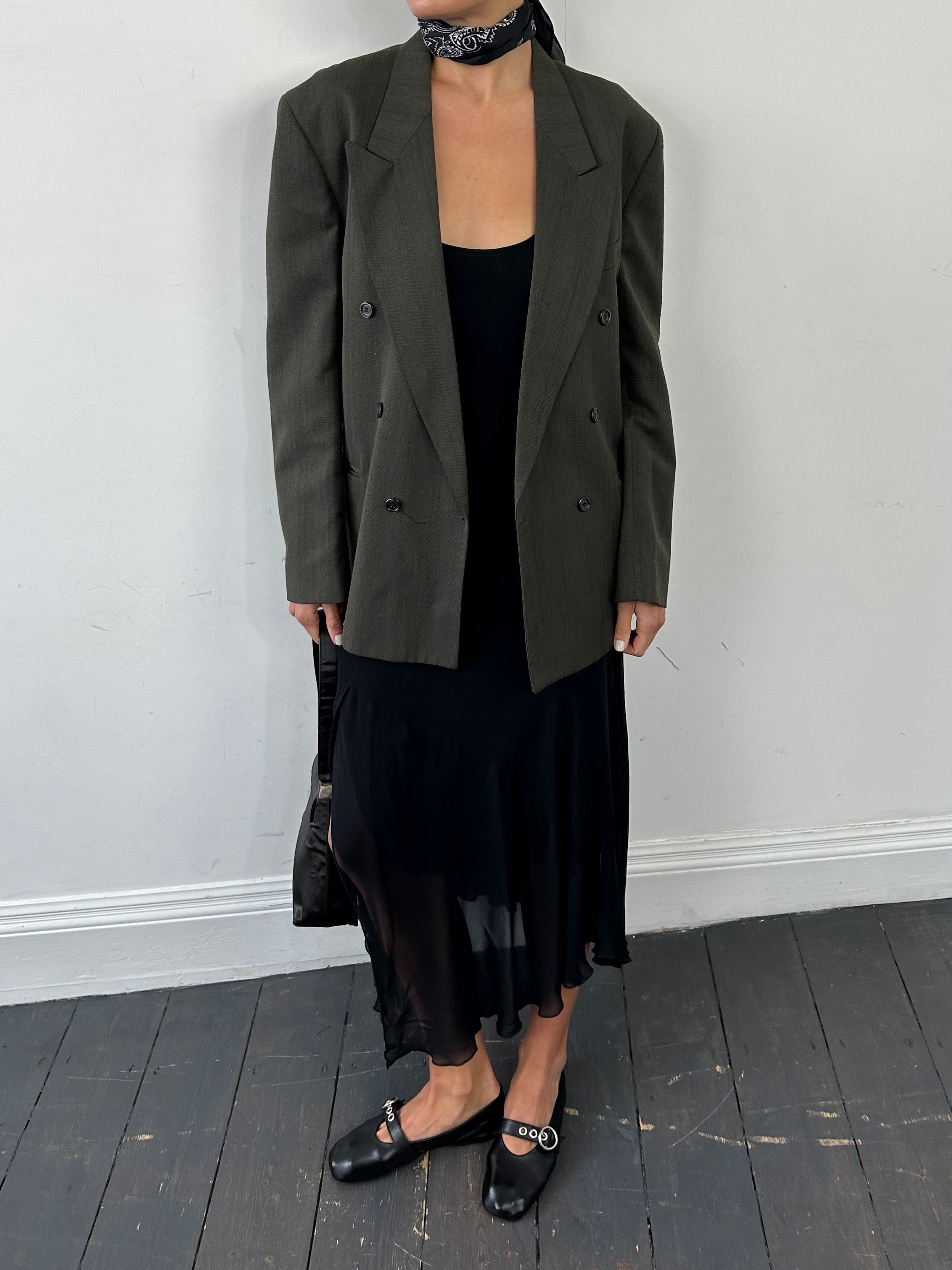 Vintage British double-breasted blazer in size 40R, classic tailored style with structured lapels and vintage fabric details.