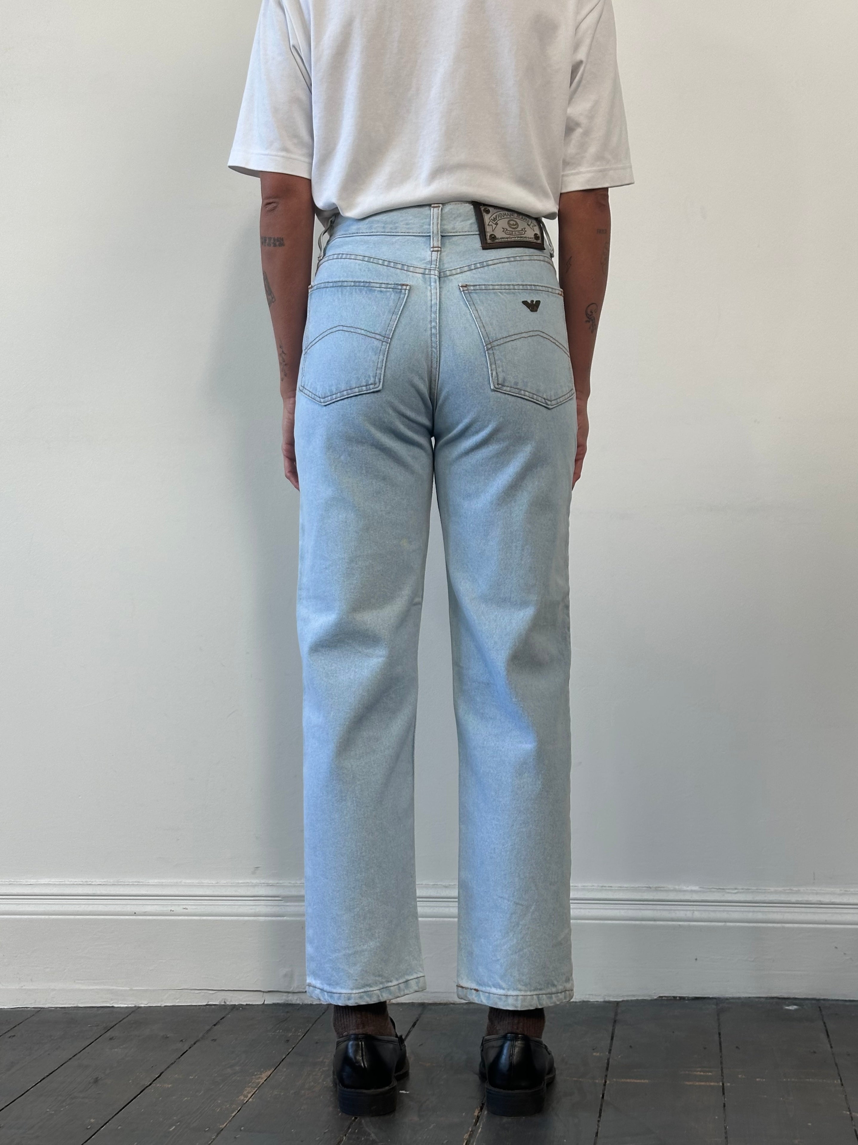 Armani Jeans light wash tapered leg denim jeans with W26 size, showcasing classic five-pocket style and slim fit.